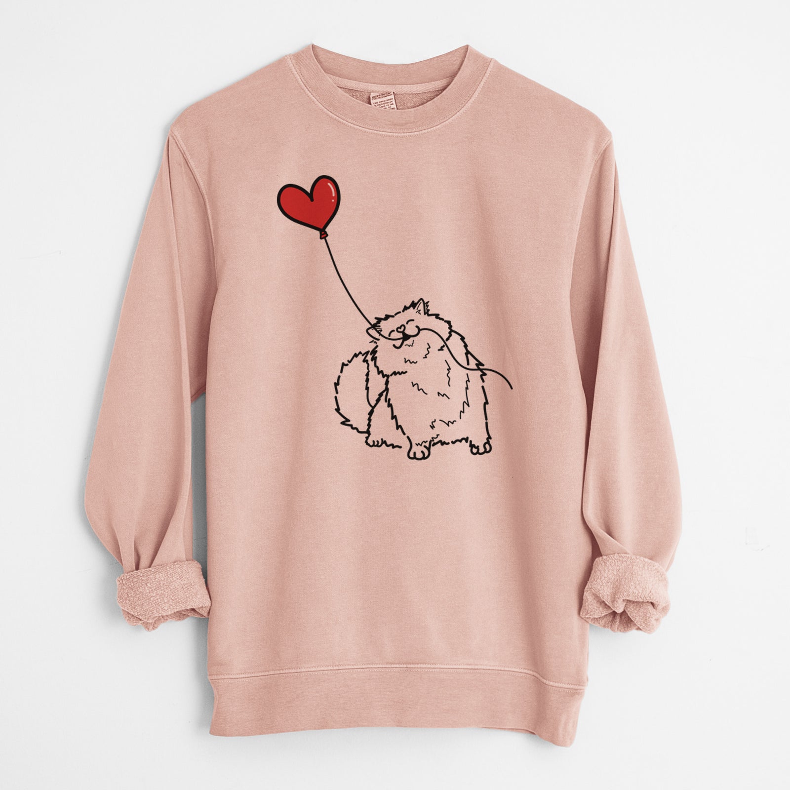 Minimalist line drawing of a Persian Cat Heart String holding a heart balloon on a Dusty Pink Unisex pigment dyed crew sweatshirt