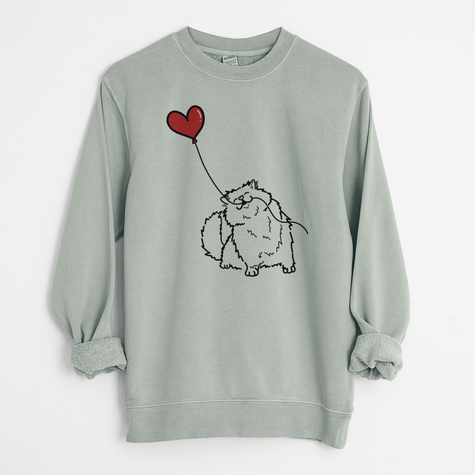 Minimalist line drawing of a Persian Cat Heart String holding a heart balloon on a Sage Unisex pigment dyed crew sweatshirt