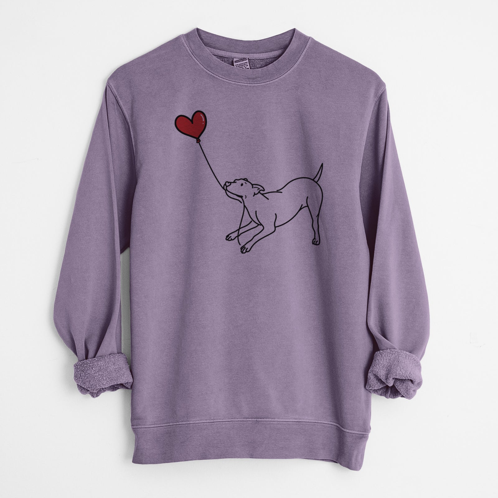 Minimalist line drawing of a Pitbull Mix Heart String holding a heart balloon on a Plum Unisex pigment dyed crew sweatshirt