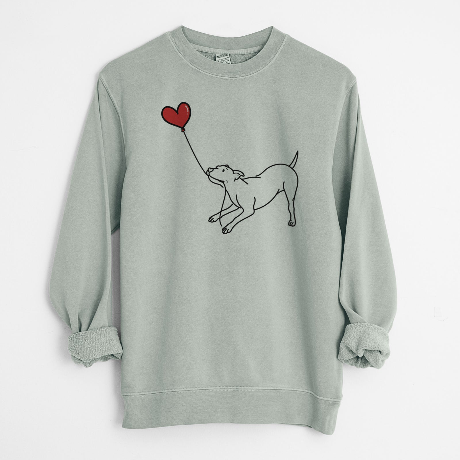 Minimalist line drawing of a Pitbull Mix Heart String holding a heart balloon on a Sage Unisex pigment dyed crew sweatshirt