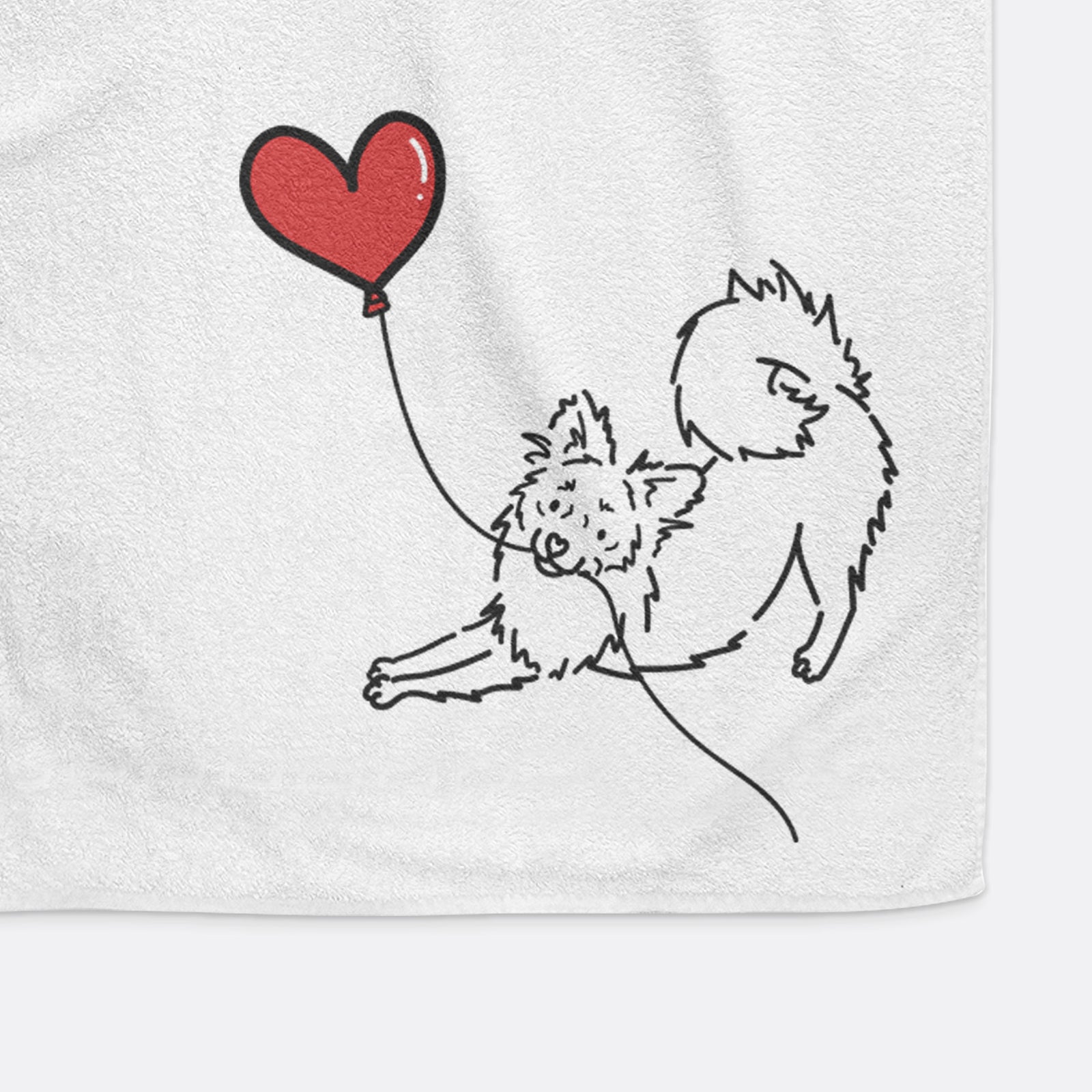 Minimalist line drawing of a Pomchi Heart String holding a heart balloon on a hand towel
