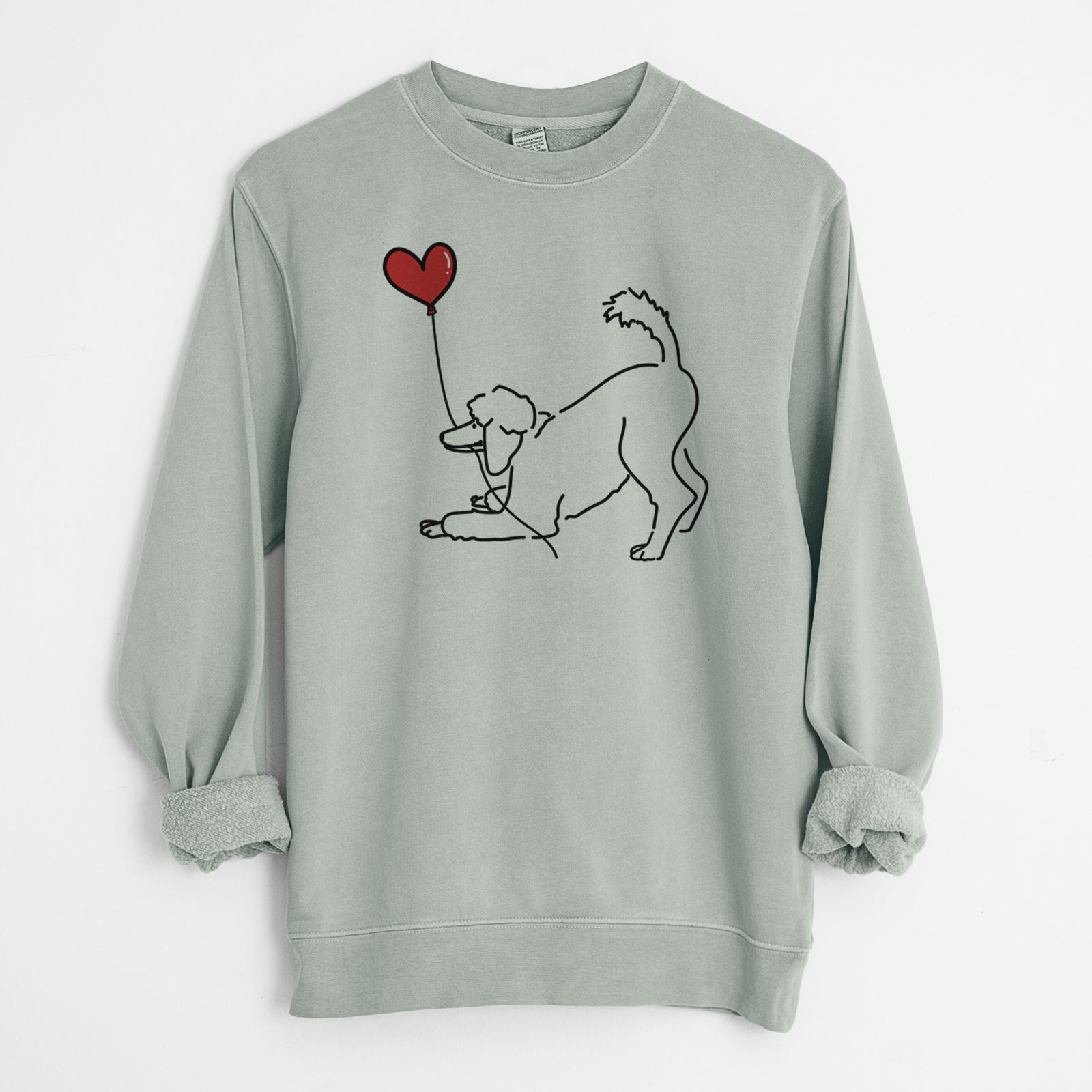 Minimalist line drawing of a Standard Poodle Heart String holding a heart balloon on a Sage Unisex pigment dyed crew sweatshirt