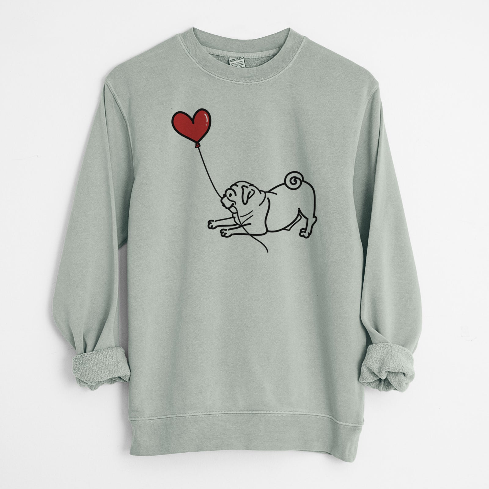 Minimalist line drawing of a Pug Heart String holding a heart balloon on a Sage Unisex pigment dyed crew sweatshirt