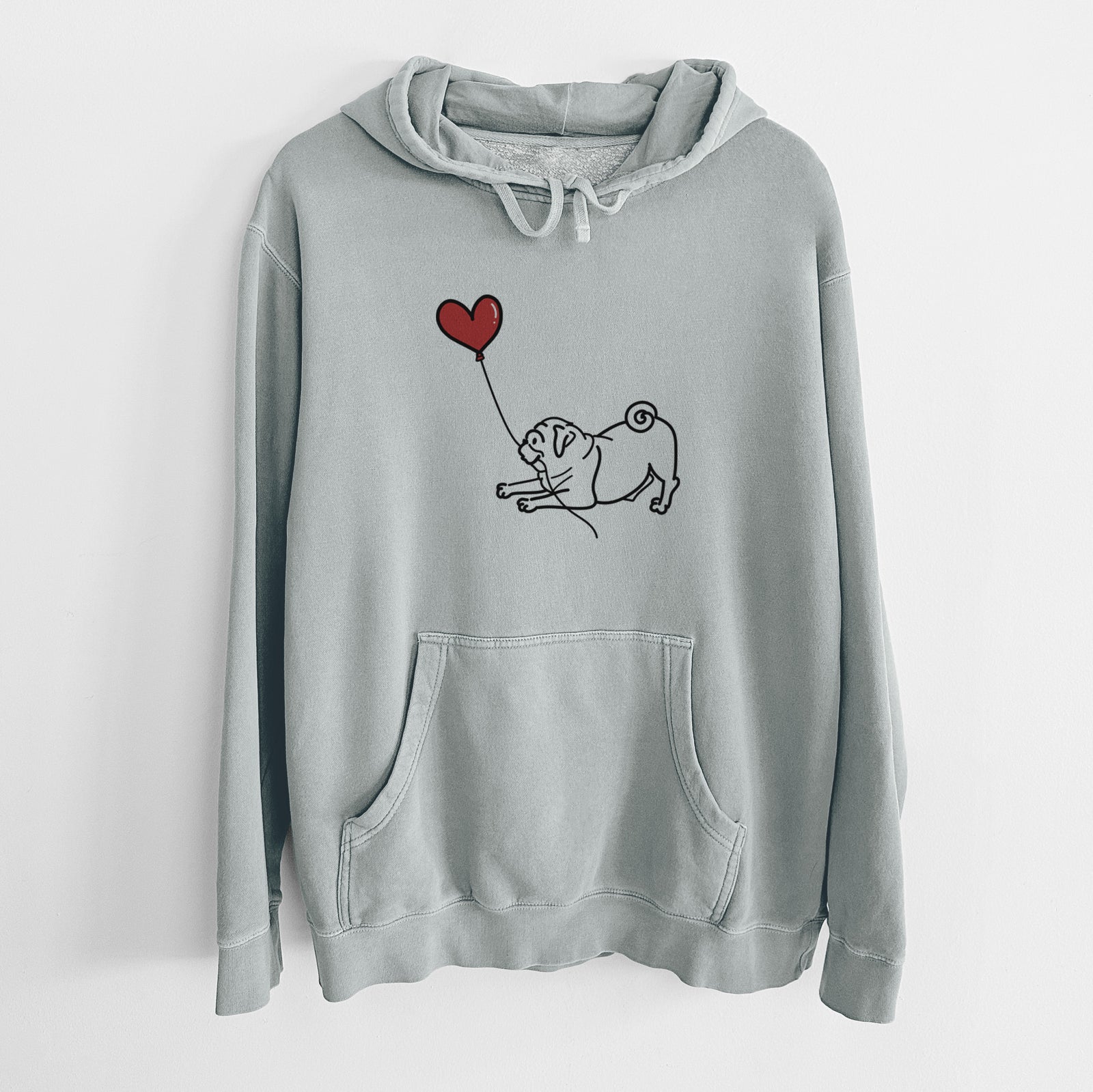 Minimalist line drawing of a Pug Heart String holding a heart balloon on a Sage Unisex pigment dyed hoodie