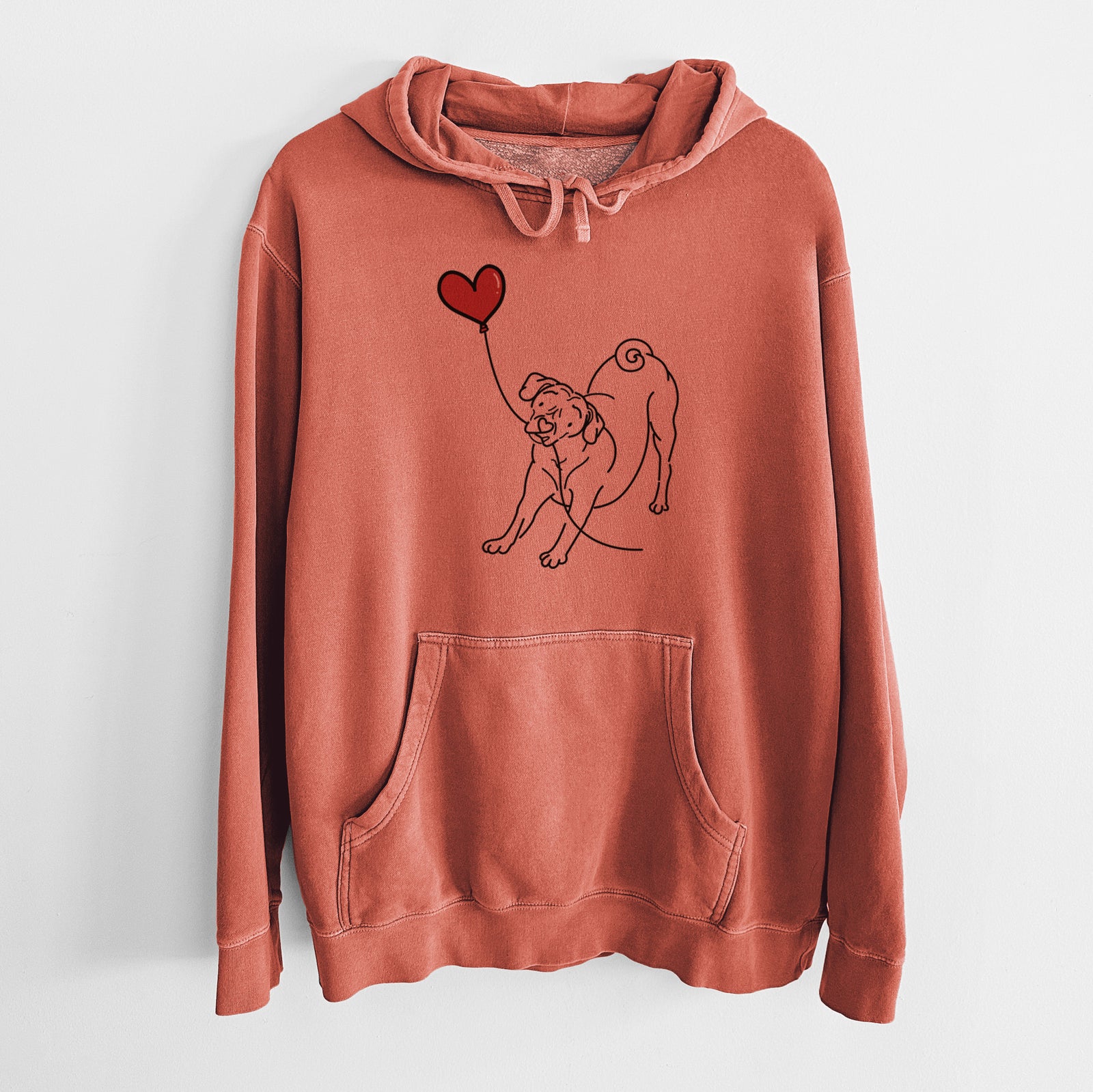 Minimalist line drawing of a Puggle Heart String holding a heart balloon on an Amber Unisex pigment dyed hoodie