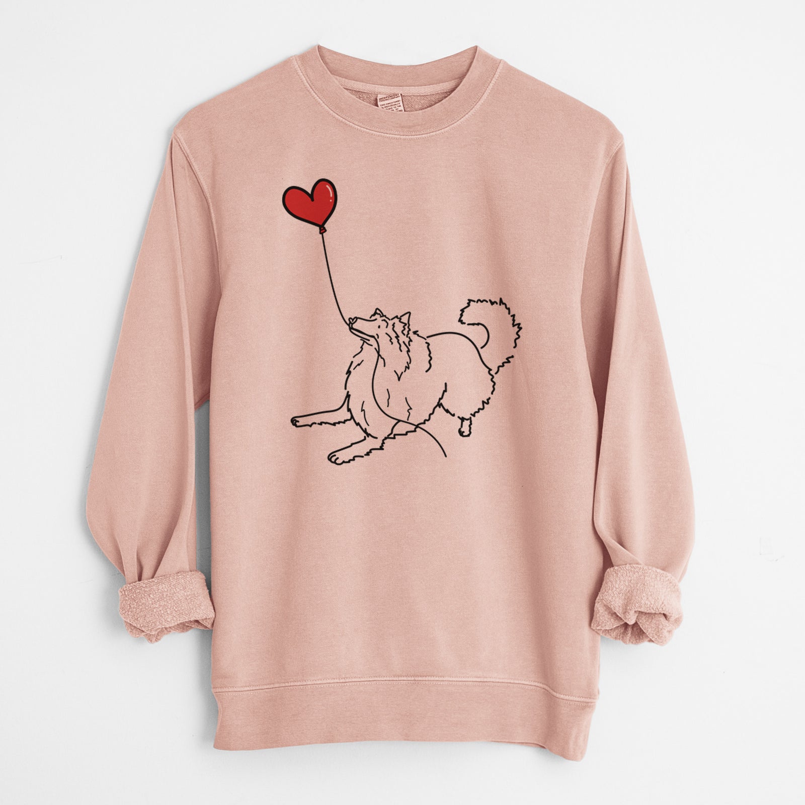 Minimalist line drawing of a Rough Collie Heart String holding a heart balloon on a Dusty Pink Unisex pigment dyed crew sweatshirt