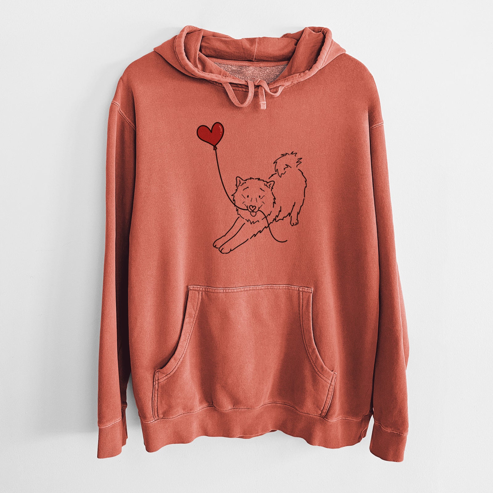 Minimalist line drawing of a Samoyed Heart String holding a heart balloon on an Amber Unisex pigment dyed hoodie
