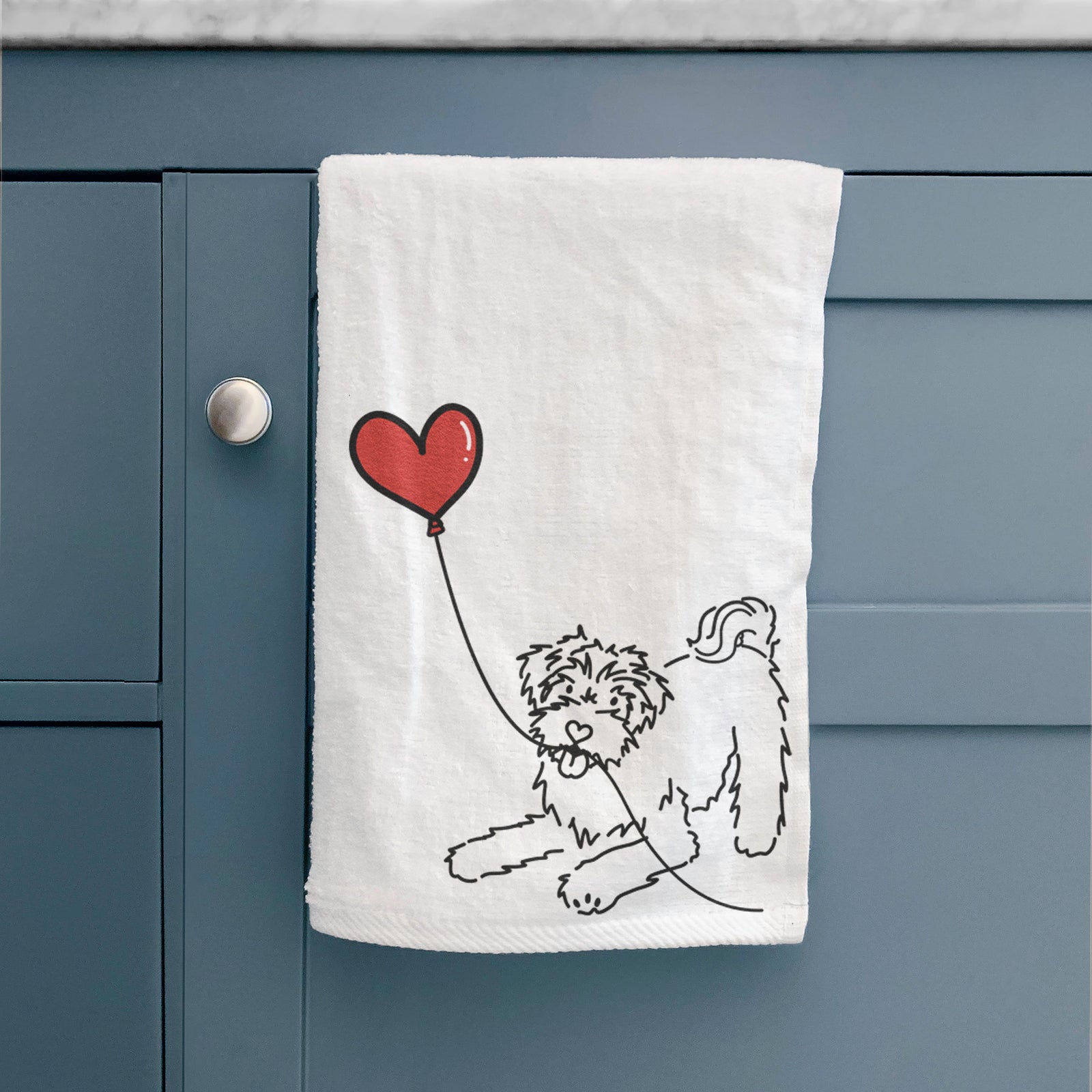 Minimalist line drawing of a Schnoodle Heart String holding a heart balloon on a hand towel