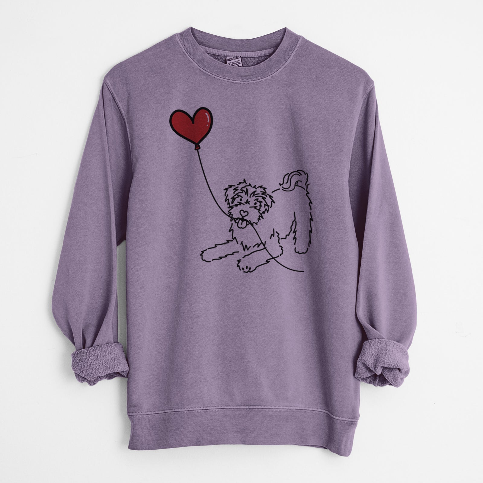 Minimalist line drawing of a Schnoodle Heart String holding a heart balloon on a Plum Unisex pigment dyed crew sweatshirt