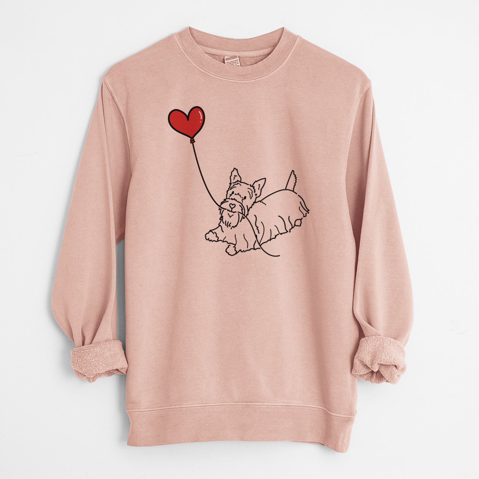 Minimalist line drawing of a Scottish Terrier Heart String holding a heart balloon on a Dusty Pink Unisex pigment dyed crew sweatshirt