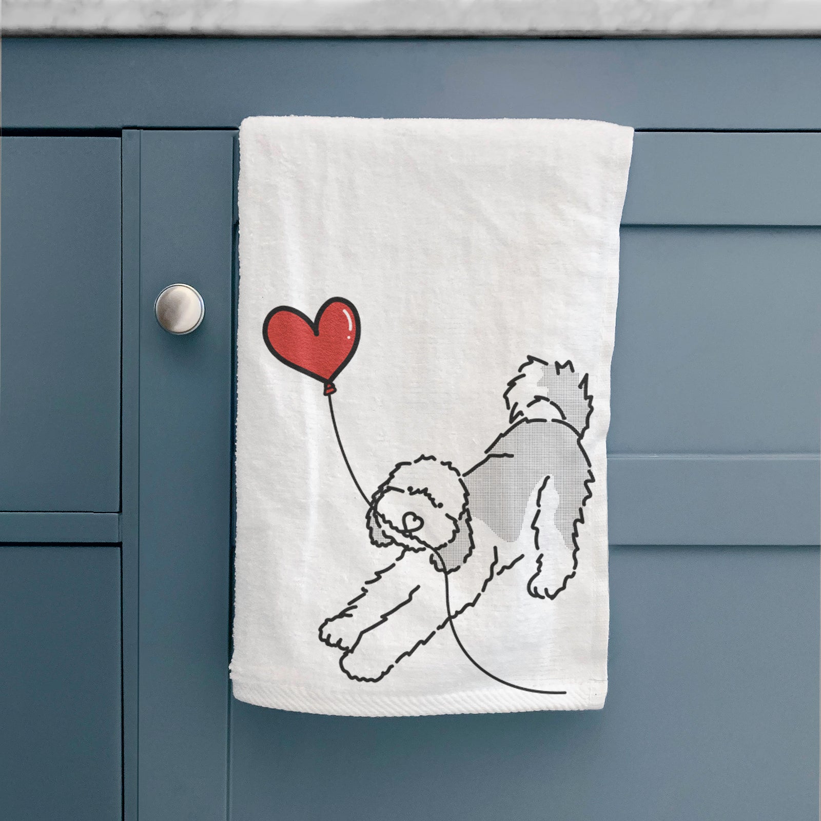 Minimalist line drawing of a Sheepadoodle Heart String holding a heart balloon on a decorative hand towel