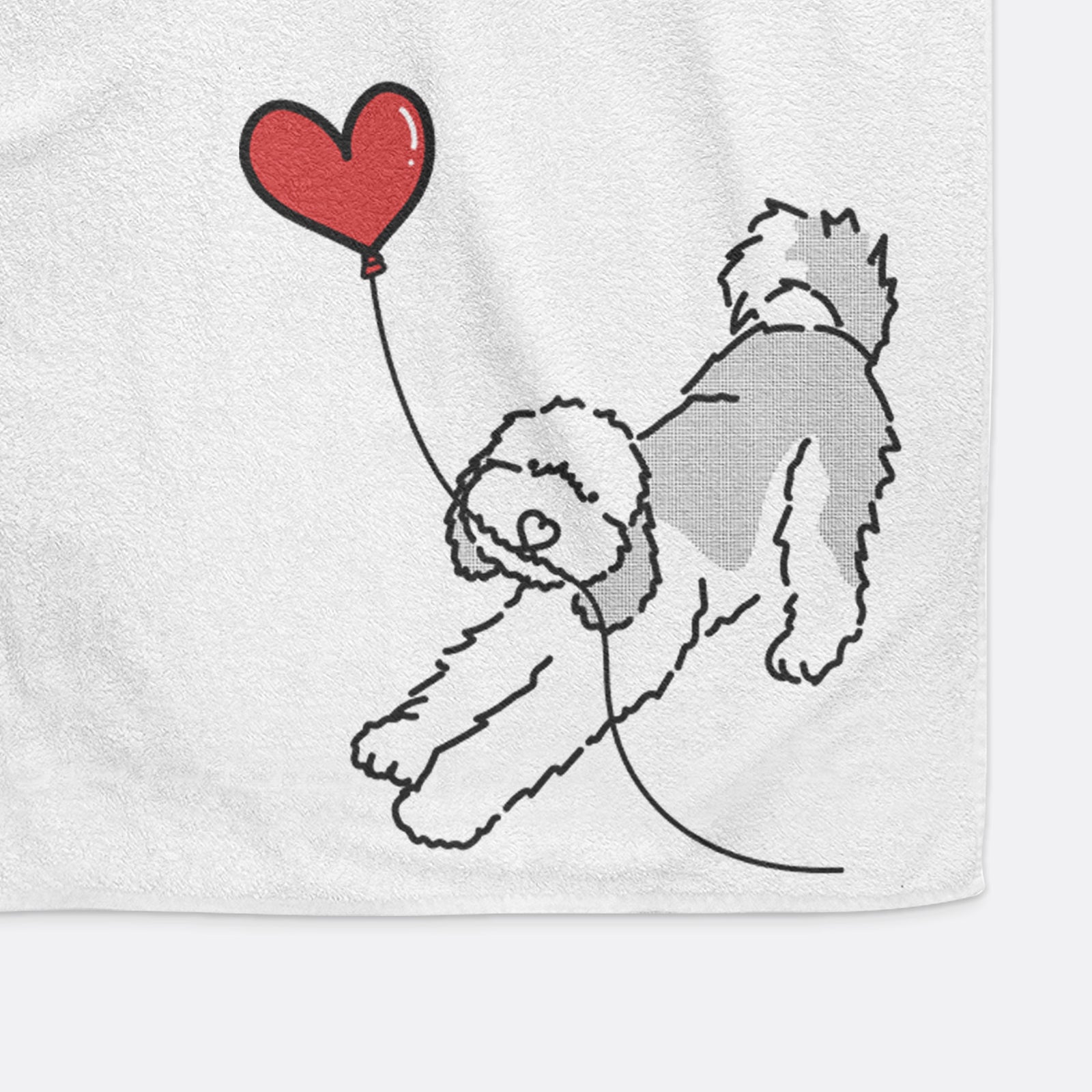 Minimalist line drawing of a Sheepadoodle Heart String holding a heart balloon on a decorative hand towel