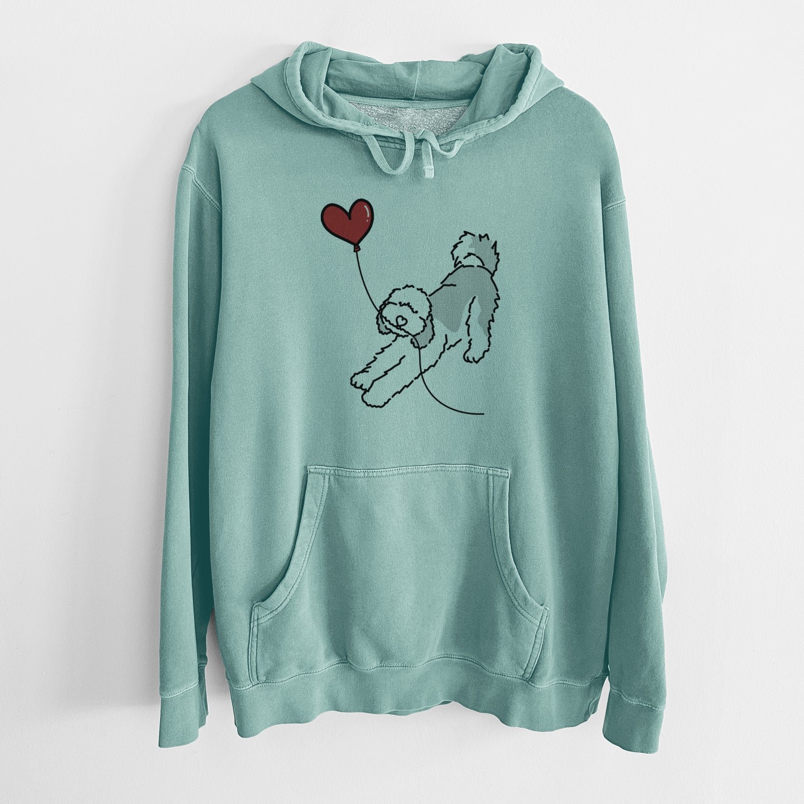 Minimalist line drawing of a Sheepadoodle Heart String holding a heart balloon on a Mint Unisex pigment dyed hoodie