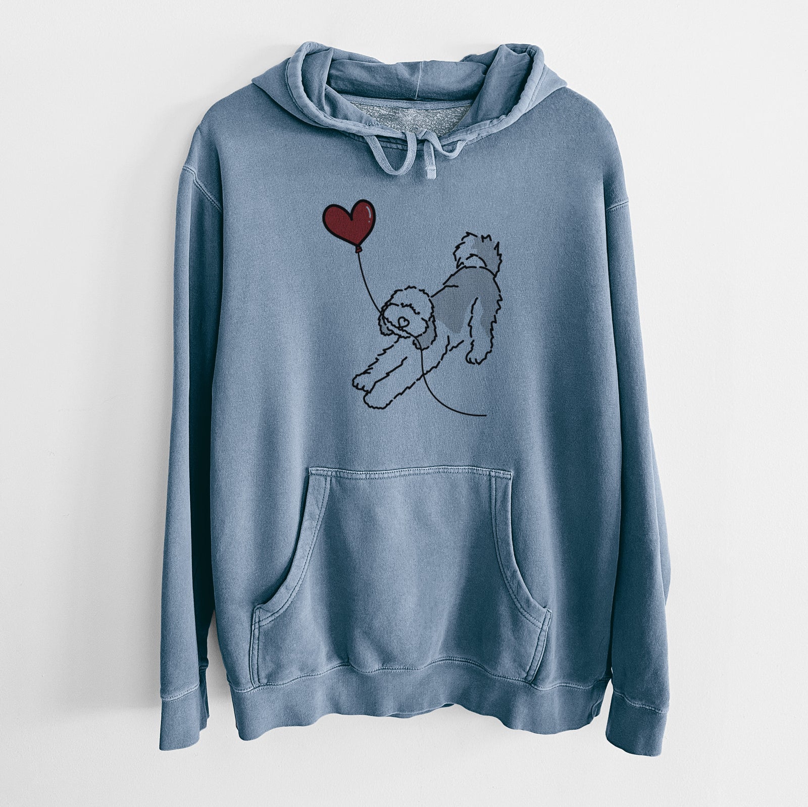 Minimalist line drawing of a Sheepadoodle Heart String holding a heart balloon on a Slate Blue Unisex pigment dyed hoodie