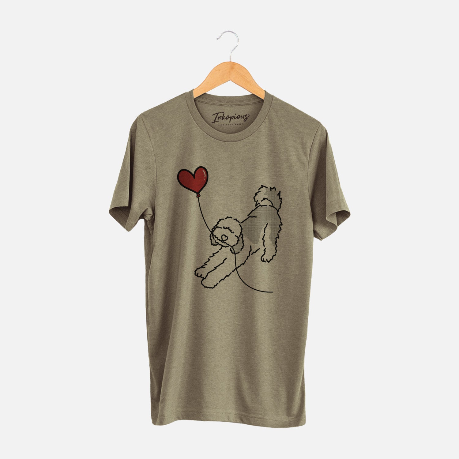 Minimalist line drawing of a Sheepadoodle Heart String holding a heart balloon on an Olive Unisex crewneck