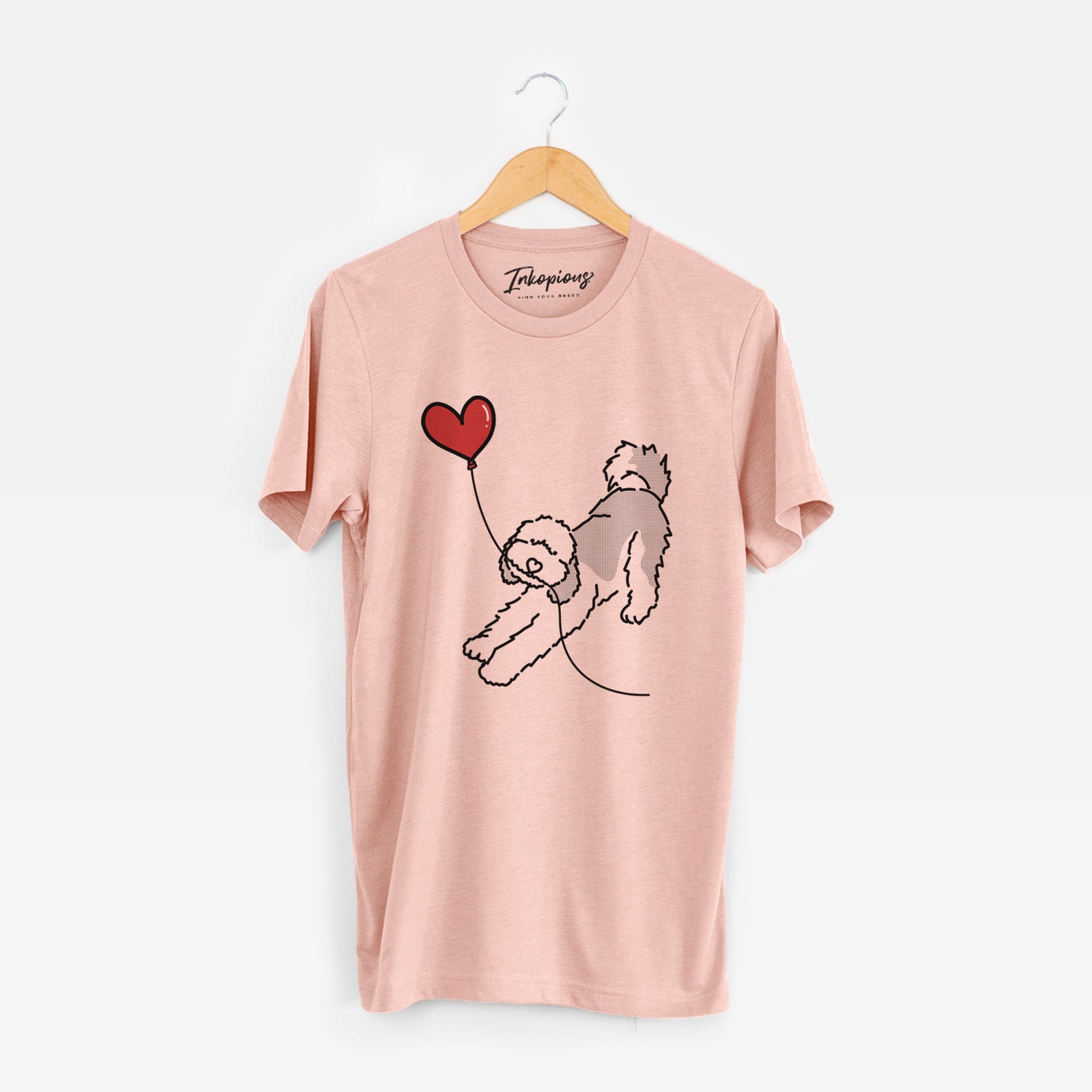 Minimalist line drawing of a Sheepadoodle Heart String holding a heart balloon on a Peach Unisex crewneck