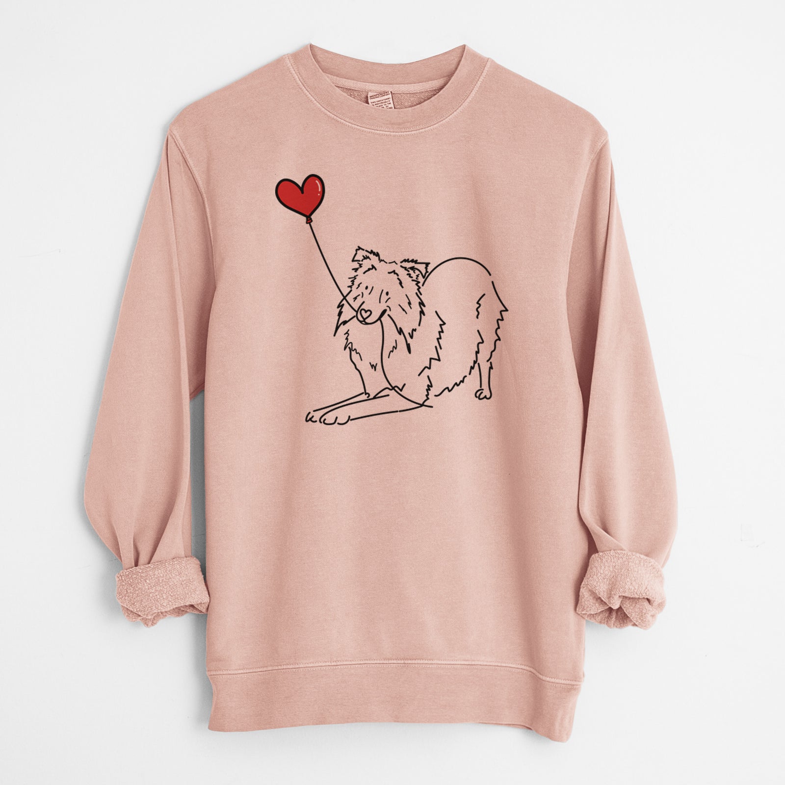 Minimalist line drawing of a Shetland Sheepdog Heart String holding a heart balloon on a Dusty Pink Unisex pigment dyed crew sweatshirt