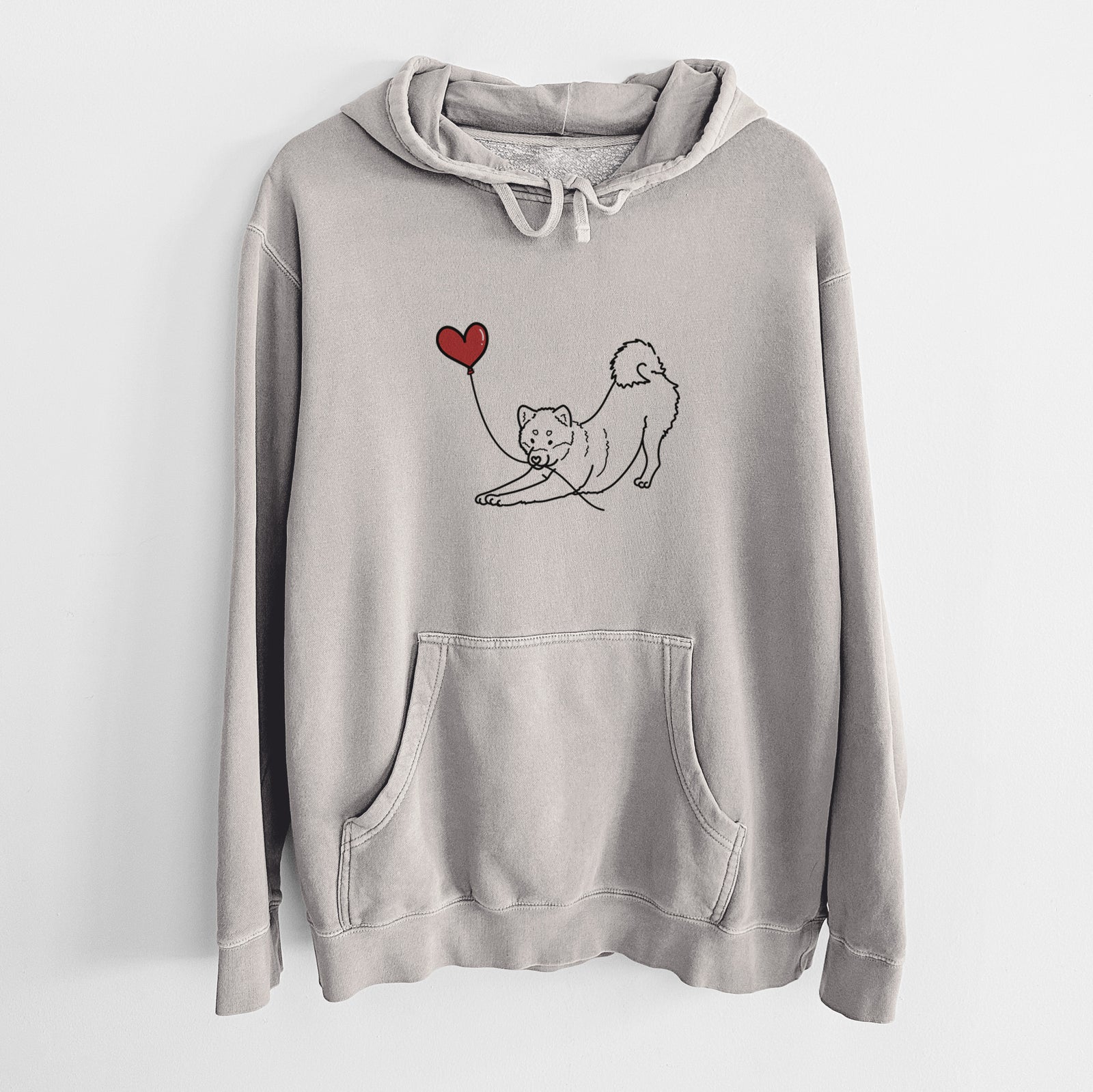Minimalist line drawing of a Shiba Inu Heart String holding a heart balloon on a Cement Unisex pigment dyed hoodie