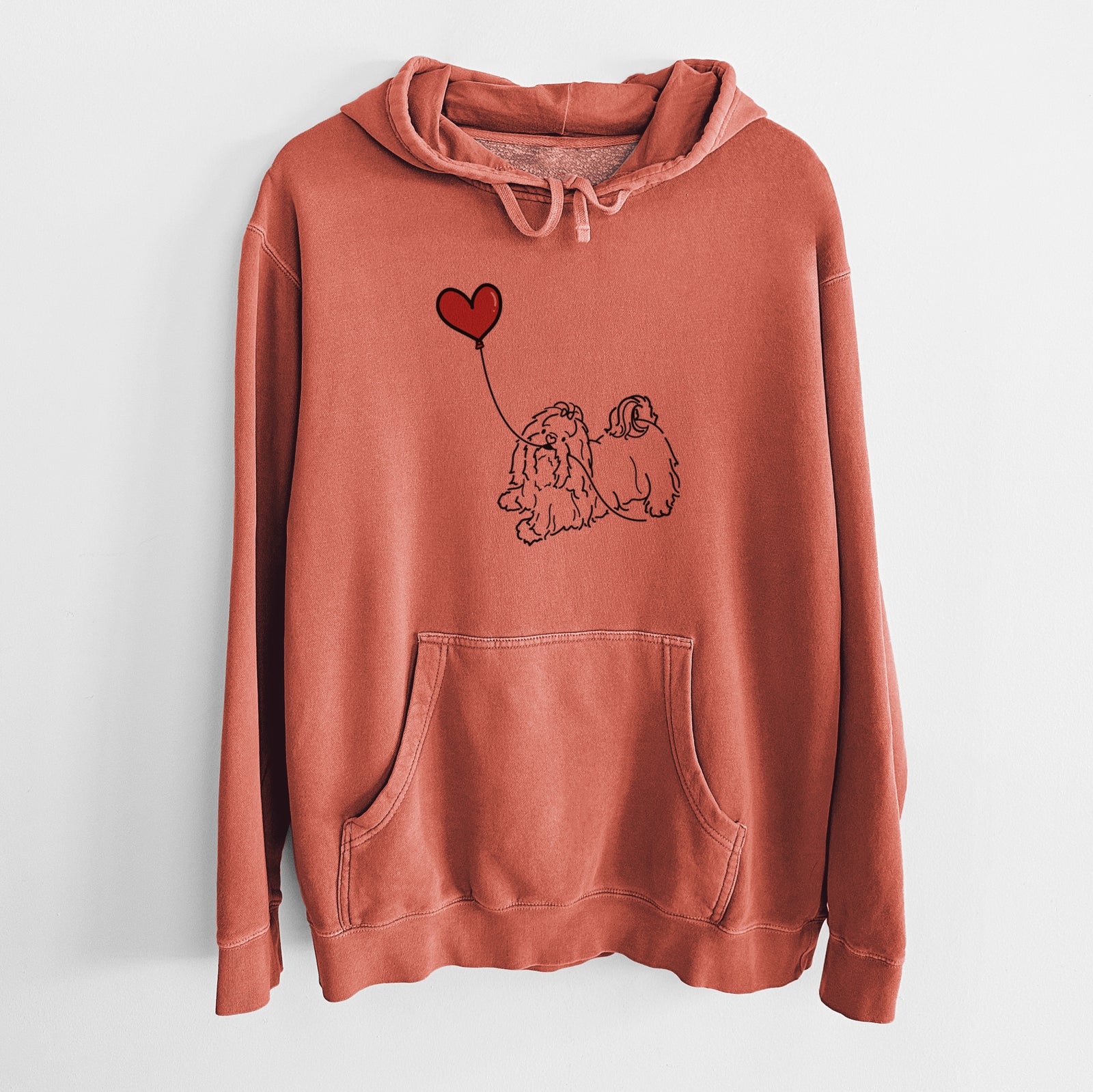 Minimalist line drawing of a Shih Tzu Heart String holding a heart balloon on an Amber Unisex pigment dyed hoodie