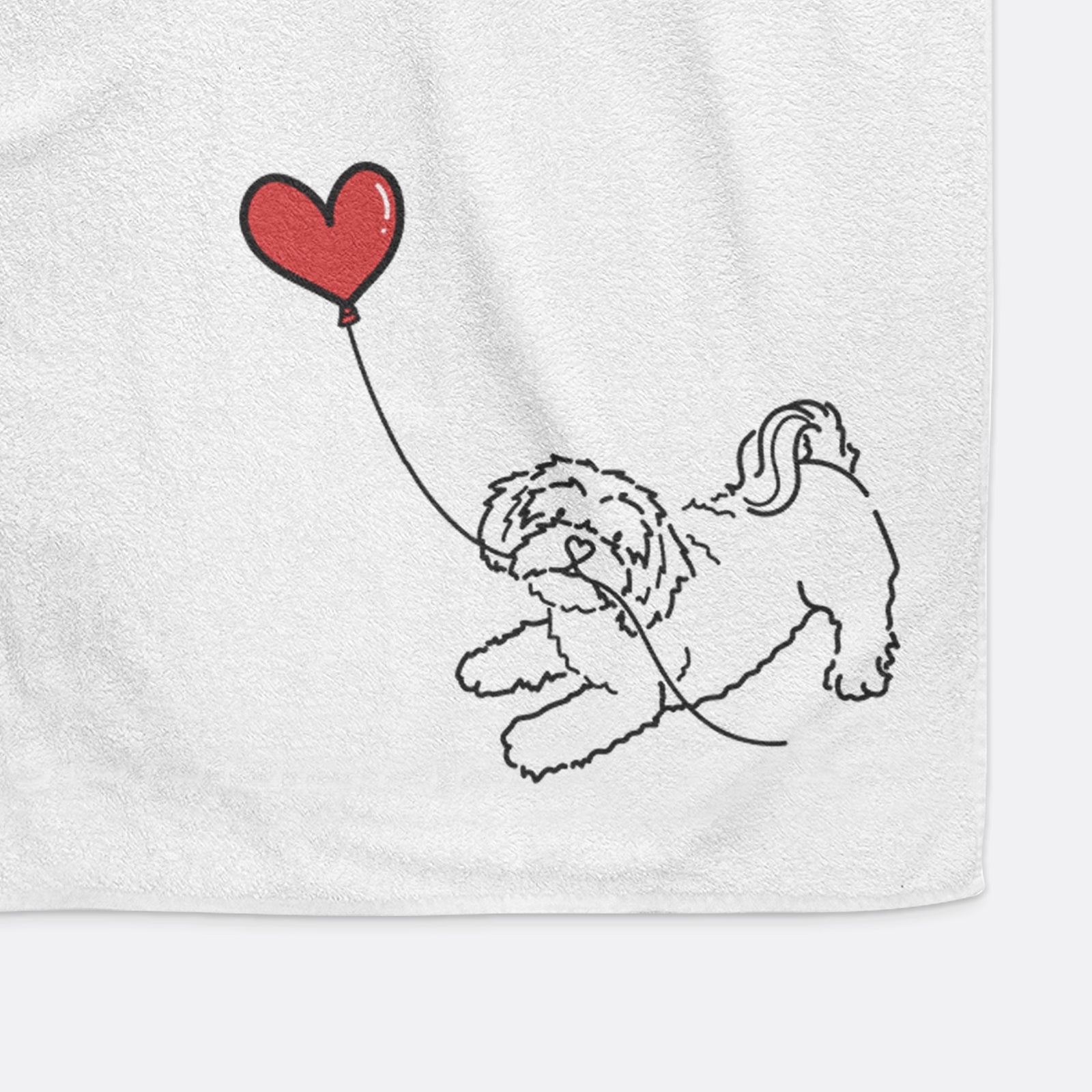 Minimalist line drawing of a Shihpoo Heart String holding a heart balloon on a decorative hand towel