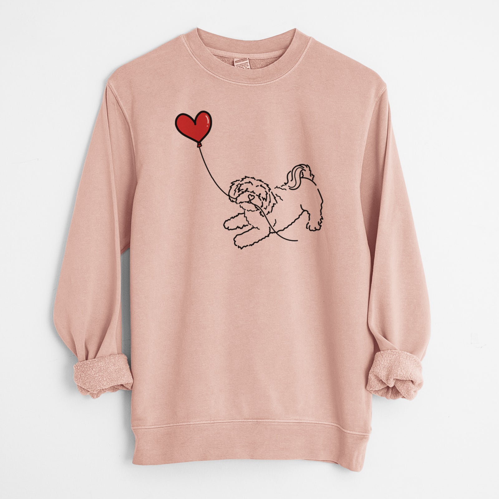 Minimalist line drawing of a Shihpoo Heart String holding a heart balloon on a Dusty Pink Unisex pigment dyed crew sweatshirt
