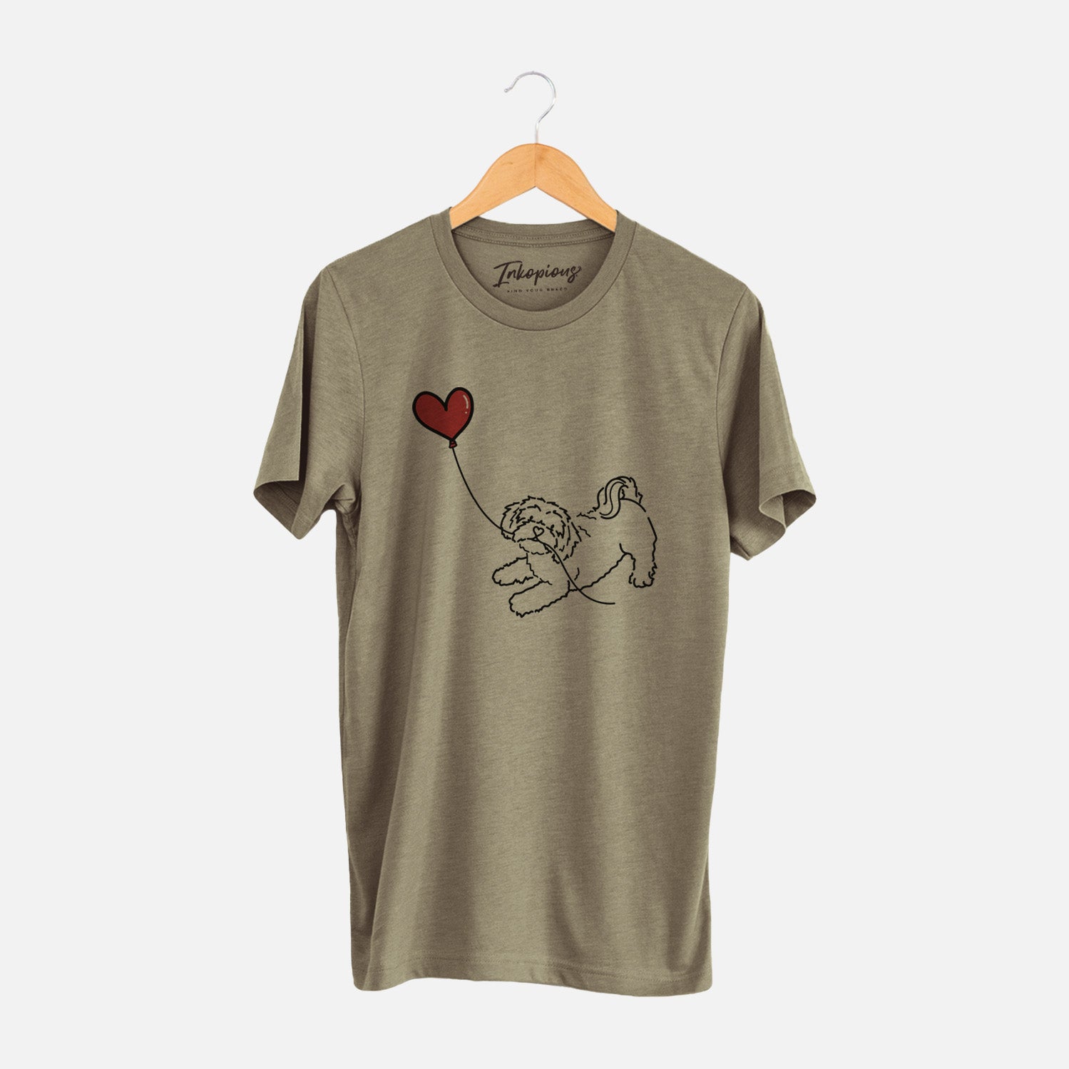 Minimalist line drawing of a Shihpoo Heart String holding a heart balloon on an Olive Unisex crewneck