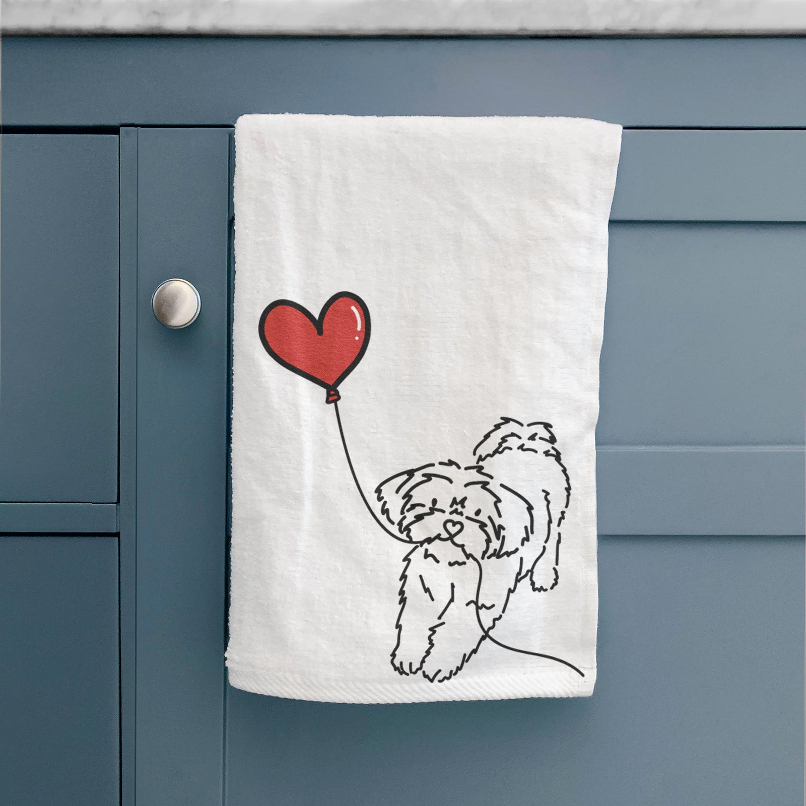 Minimalist line drawing of a Shorkie Heart String holding a heart balloon on a hand towel