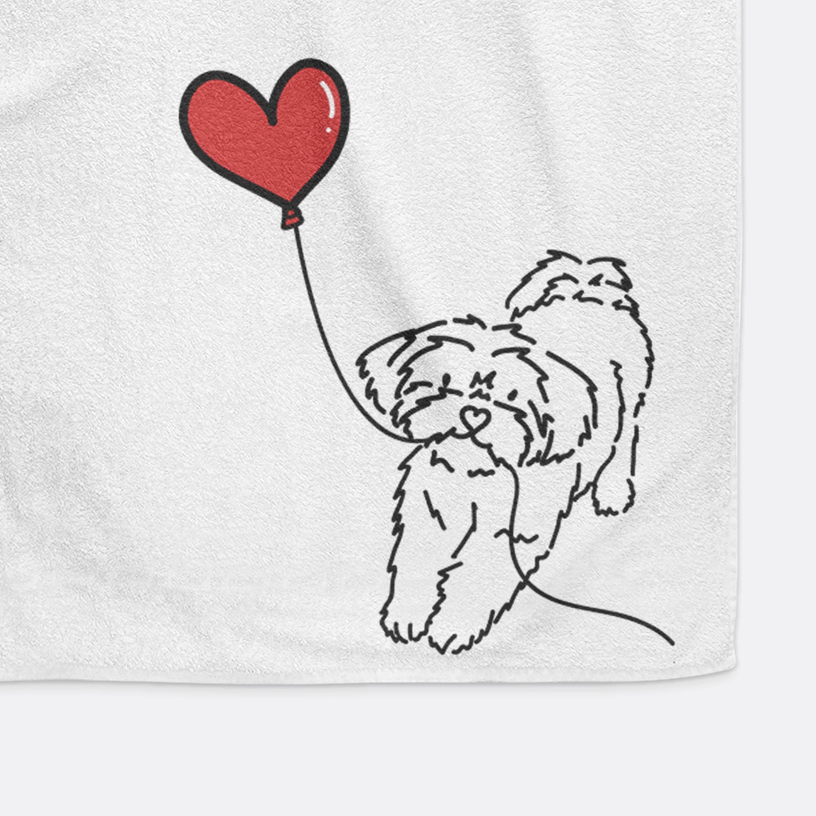 Minimalist line drawing of a Shorkie Heart String holding a heart balloon on a hand towel