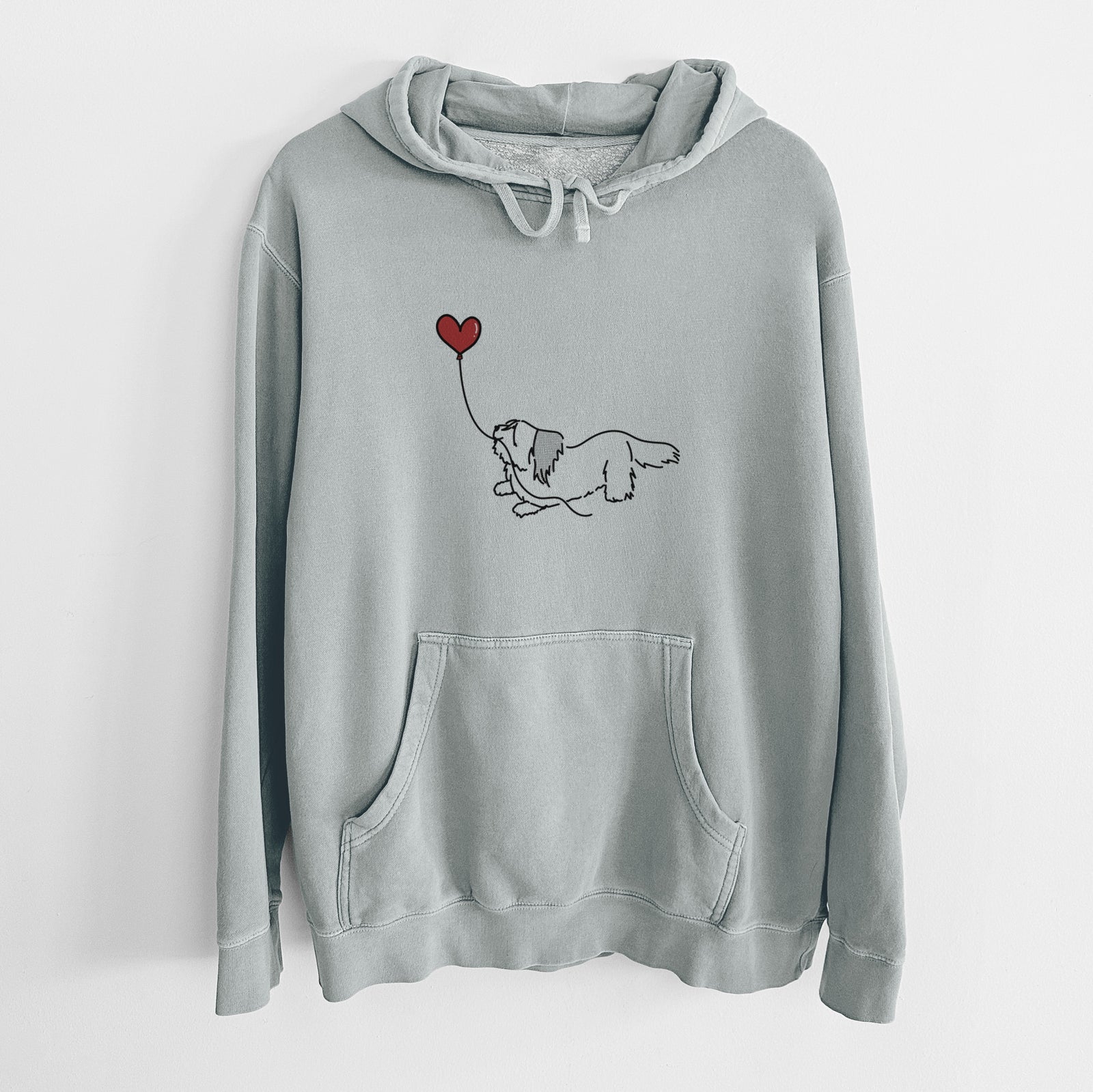 Minimalist line drawing of a Skye Terrier Heart String holding a heart balloon on a Sage Unisex pigment dyed hoodie