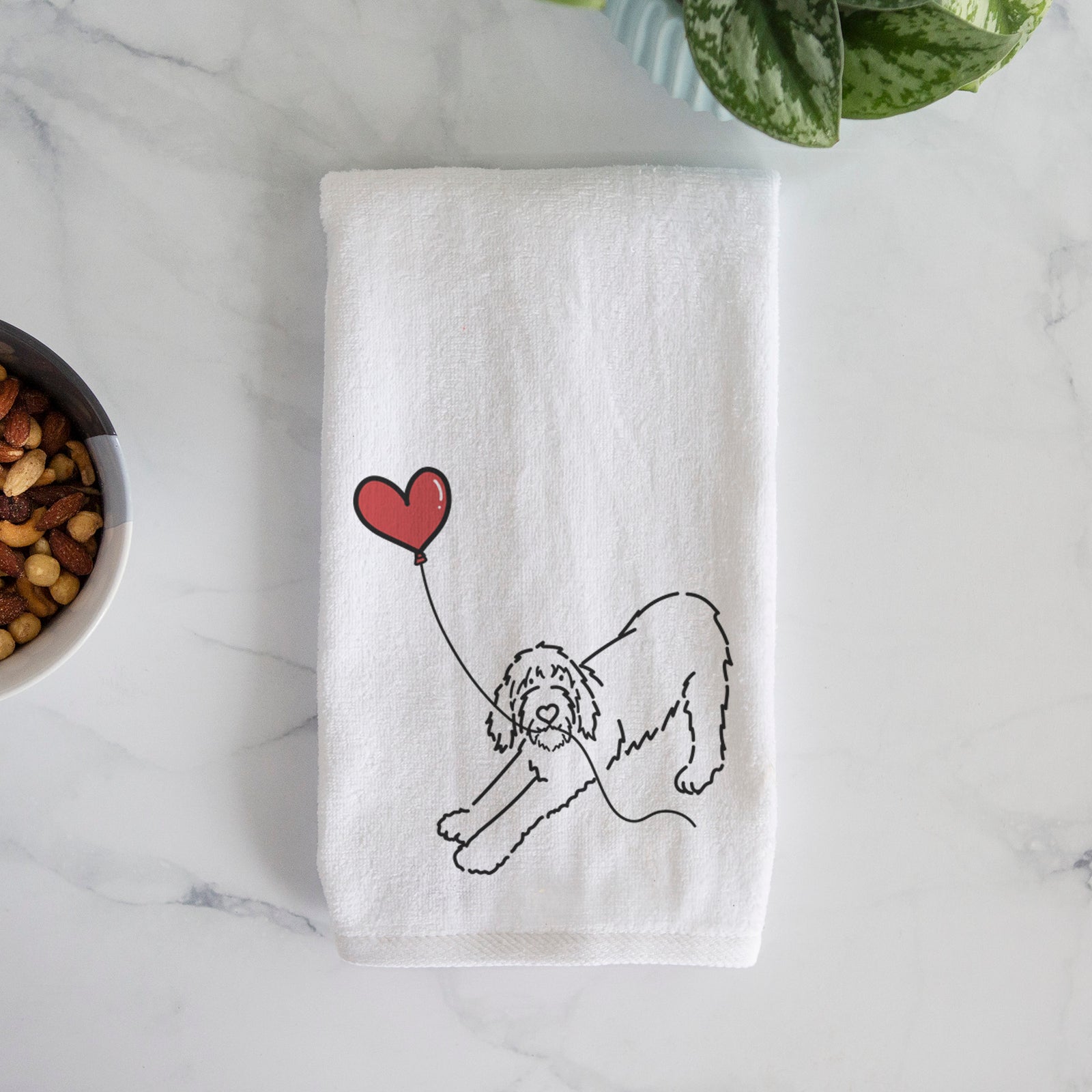 Minimalist line drawing of a Spinone Italiano Heart String holding a heart balloon on a decorative hand towel