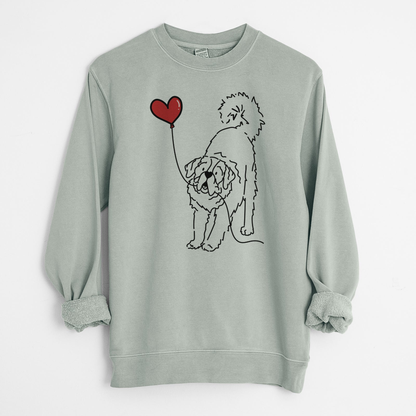 Minimalist line drawing of a Saint Bernard Heart String holding a heart balloon on a Sage Unisex pigment dyed crew sweatshirt