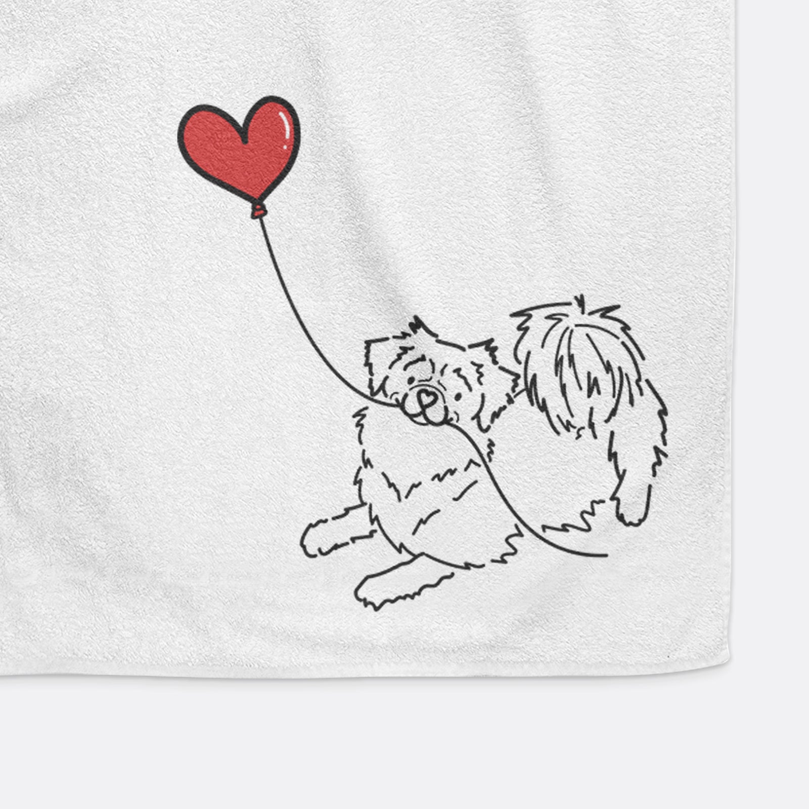 Minimalist line drawing of a Tibetan Spaniel Heart String holding a heart balloon on a decorative hand towel