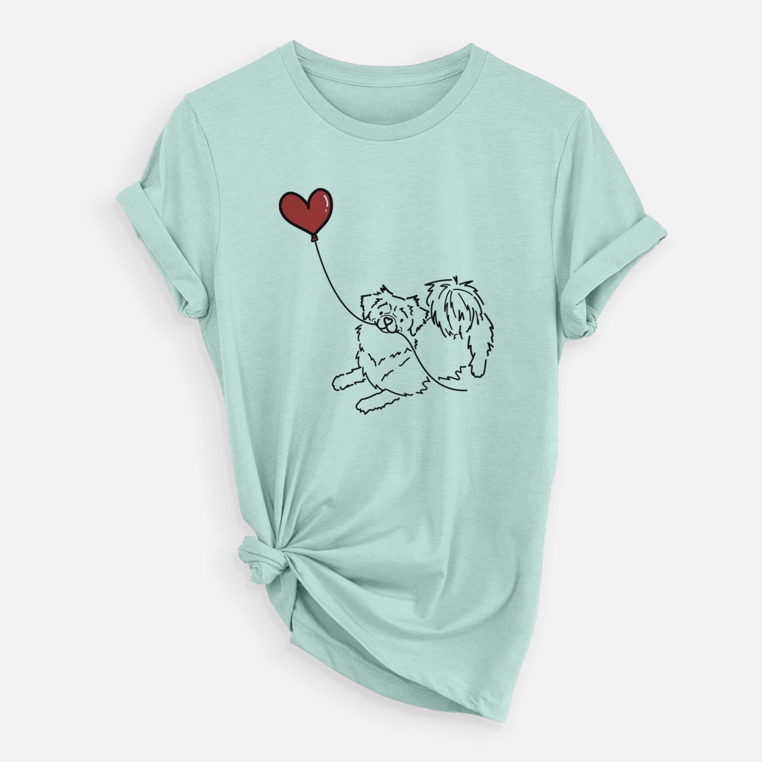 Minimalist line drawing of a Tibetan Spaniel Heart String holding a heart balloon on a Heather Sage Unisex crewneck