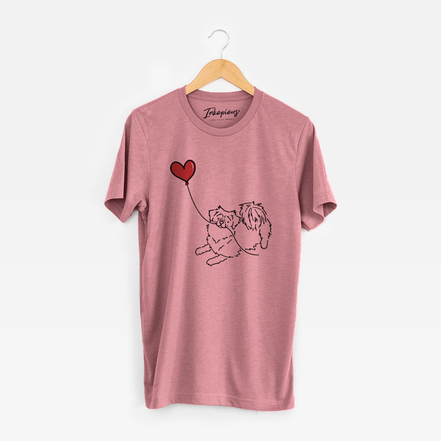 Minimalist line drawing of a Tibetan Spaniel Heart String holding a heart balloon on a Mauve Unisex crewneck