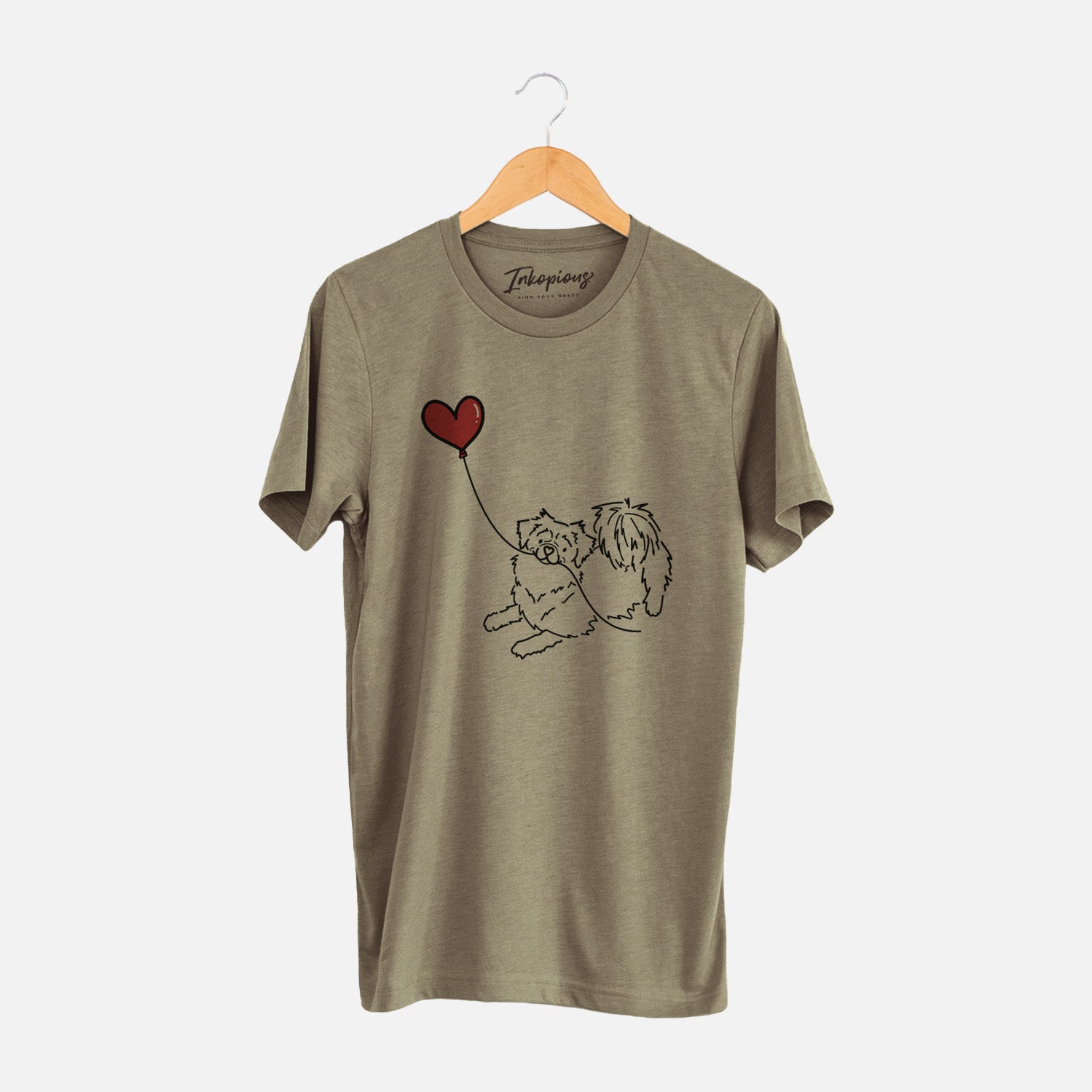 Minimalist line drawing of a Tibetan Spaniel Heart String holding a heart balloon on an Olive Unisex crewneck