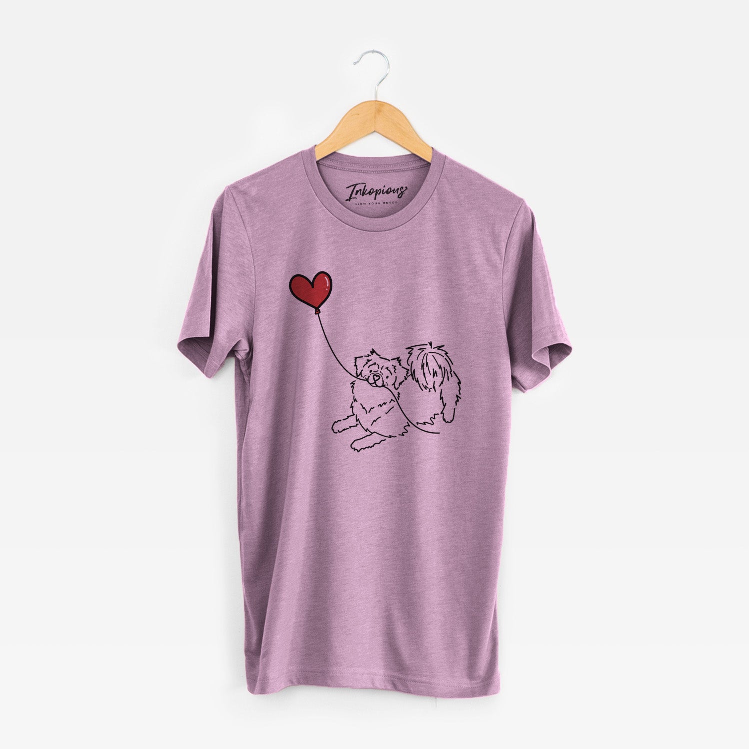 Minimalist line drawing of a Tibetan Spaniel Heart String holding a heart balloon on an Orchid Unisex crewneck