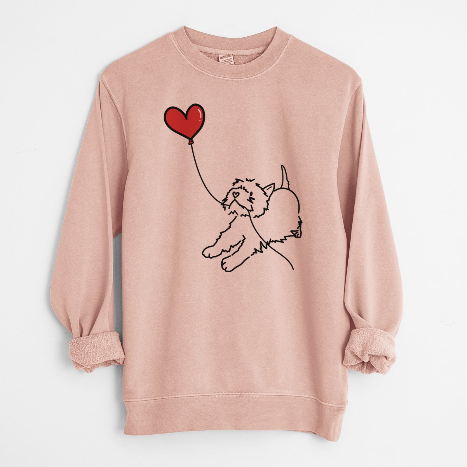 Minimalist line drawing of a West Highland Terrier Heart String holding a heart balloon on a Dusty Pink Unisex pigment dyed crew sweatshirt