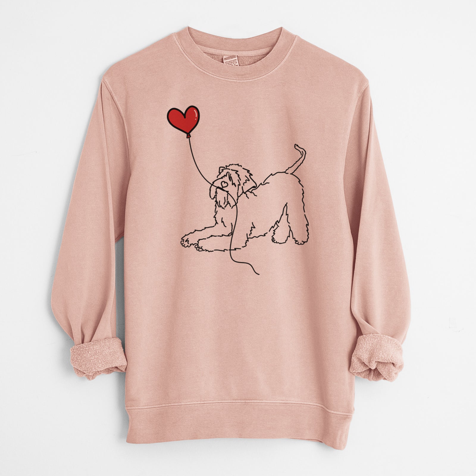 Minimalist line drawing of a Soft-Coated Wheaten Terrier Heart String holding a heart balloon on a Dusty Pink Unisex pigment dyed crew sweatshirt