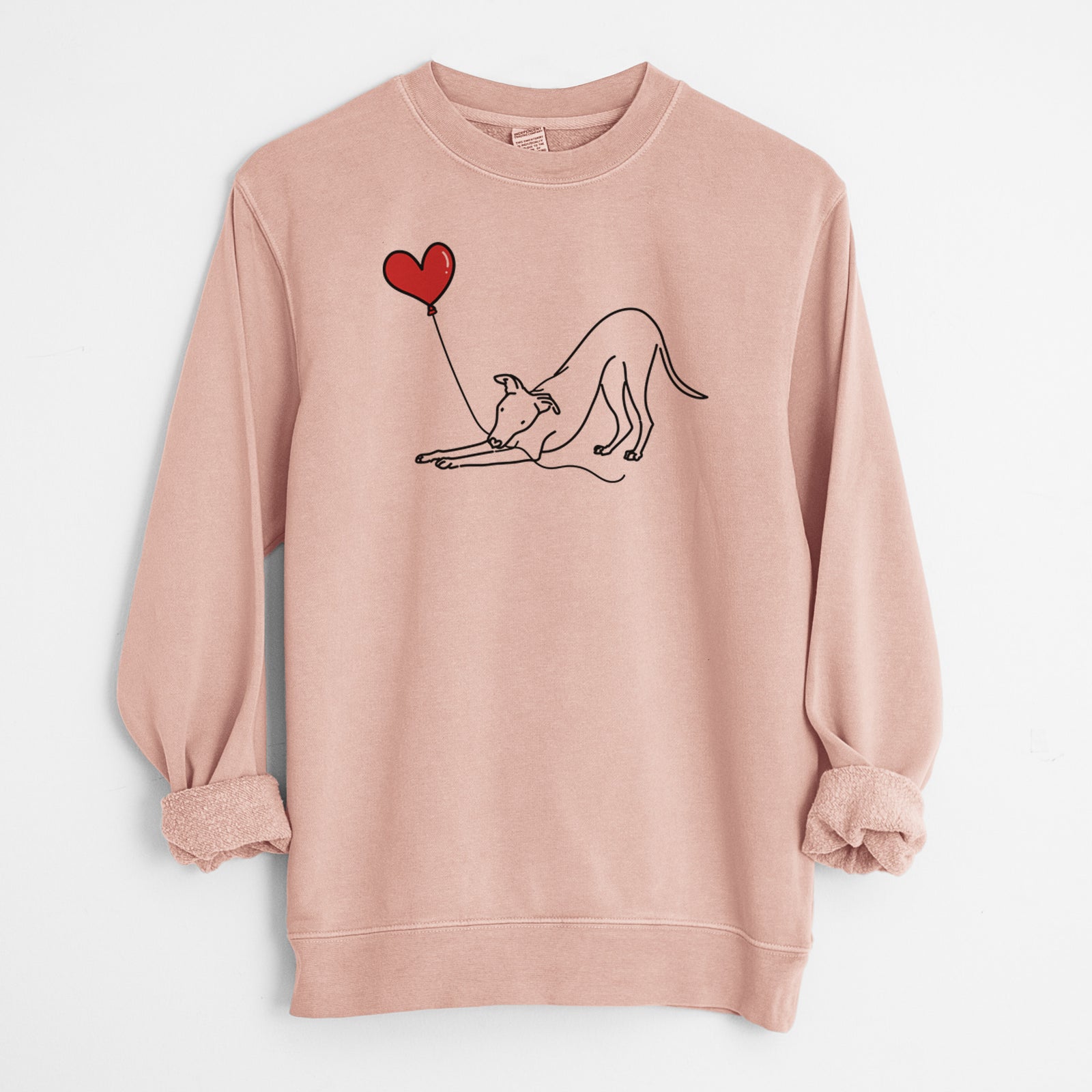 Minimalist line drawing of a Whippet Heart String holding a heart balloon on a Dusty Pink Unisex pigment dyed crew sweatshirt