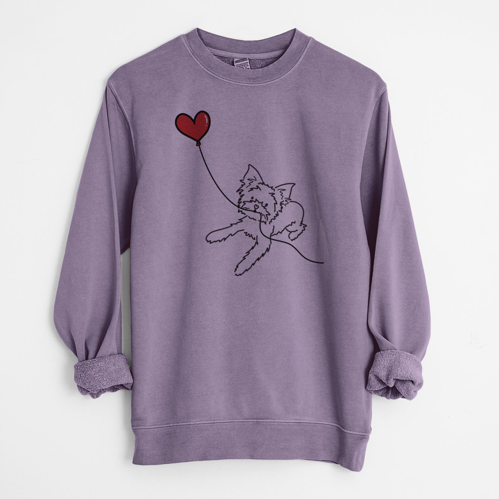 Minimalist line drawing of a Yorkshire Terrier Heart String holding a heart balloon on a Plum Unisex pigment dyed crew sweatshirt