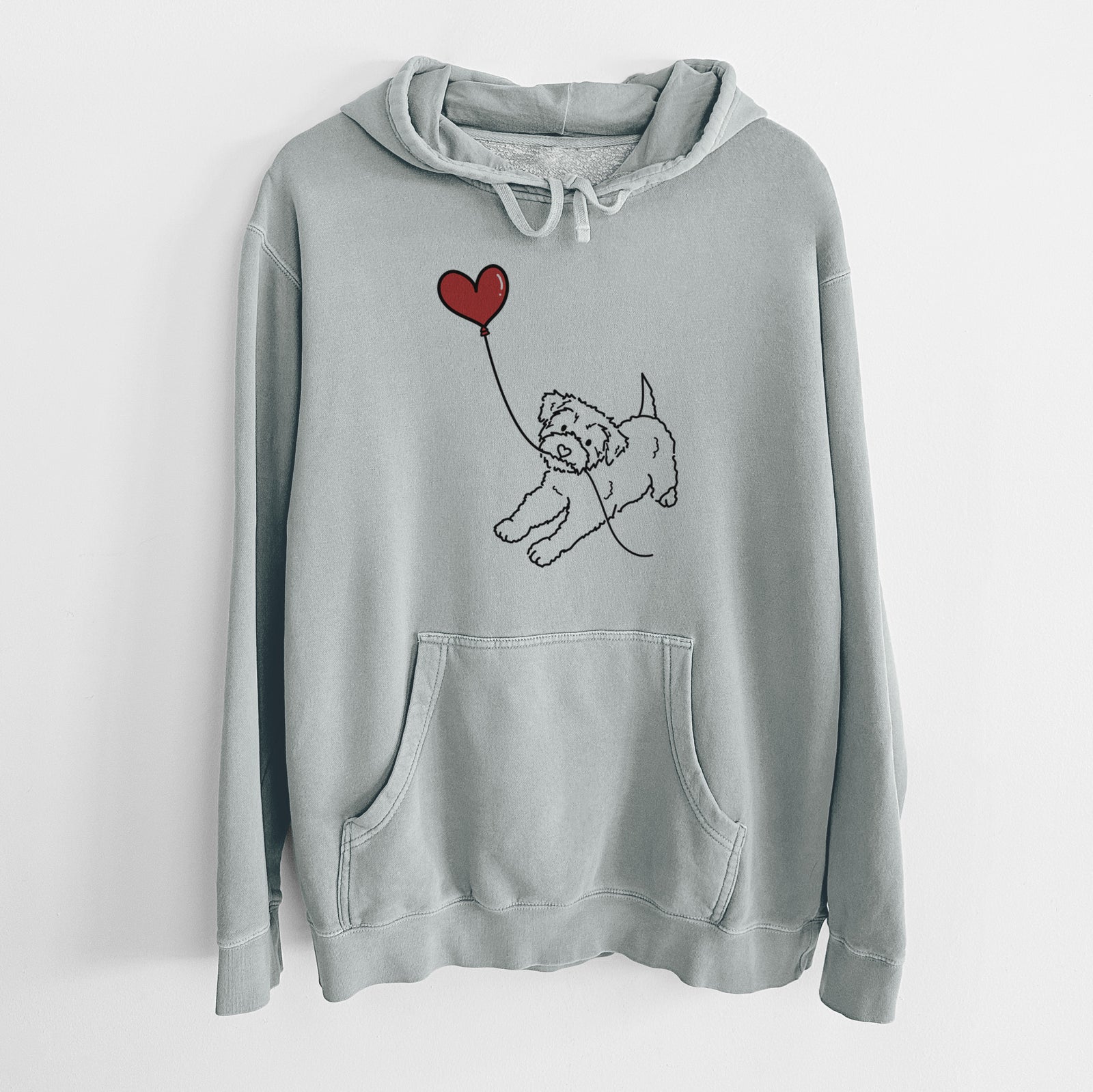 Minimalist line drawing of a Yorkiepoo Heart String holding a heart balloon on a Sage Unisex pigment dyed hoodie