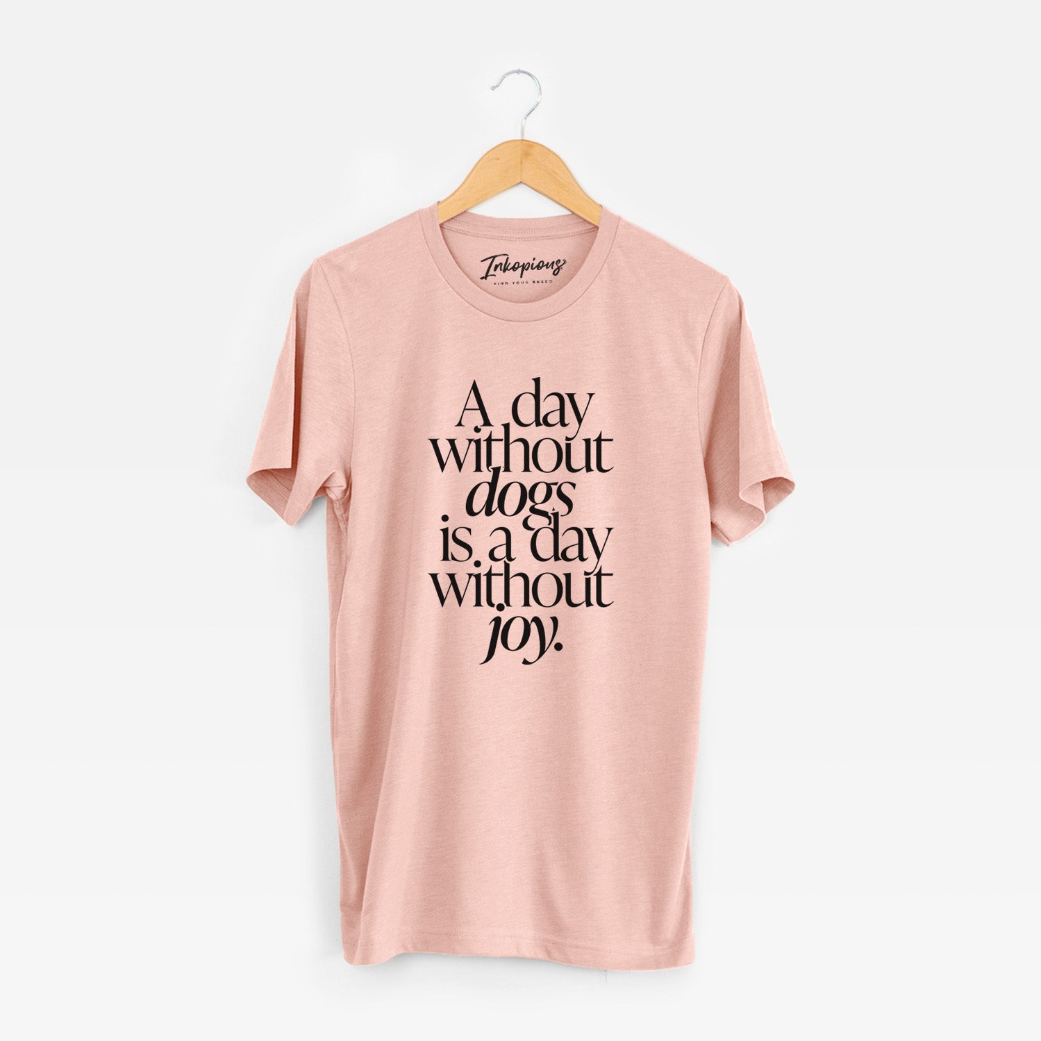 'A day without Dogs is a day without joy' design on a Peach Unisex crewneck