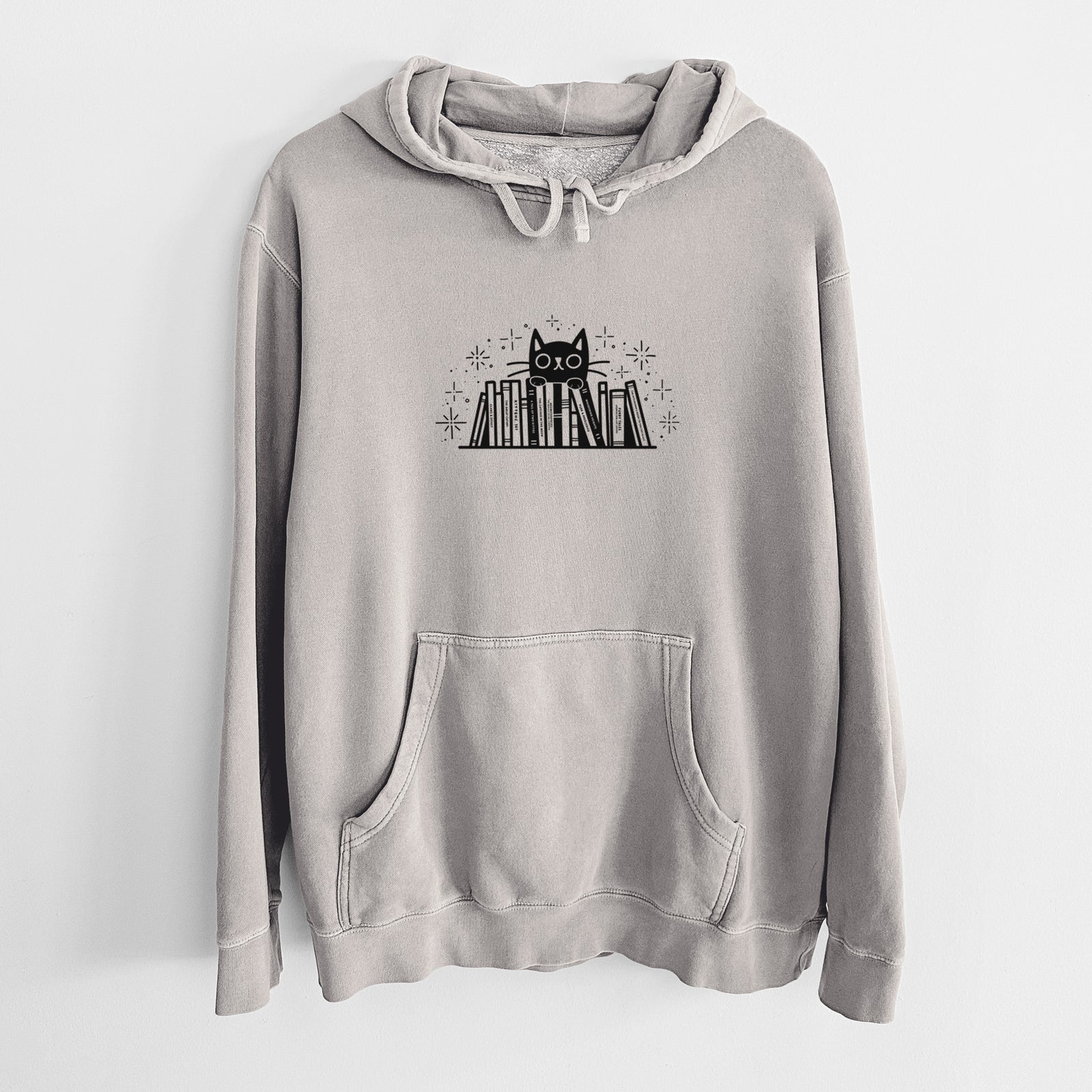 'Kitty Library - Black Cat Behind Books' design on a Cement Unisex pigment dyed hoodie