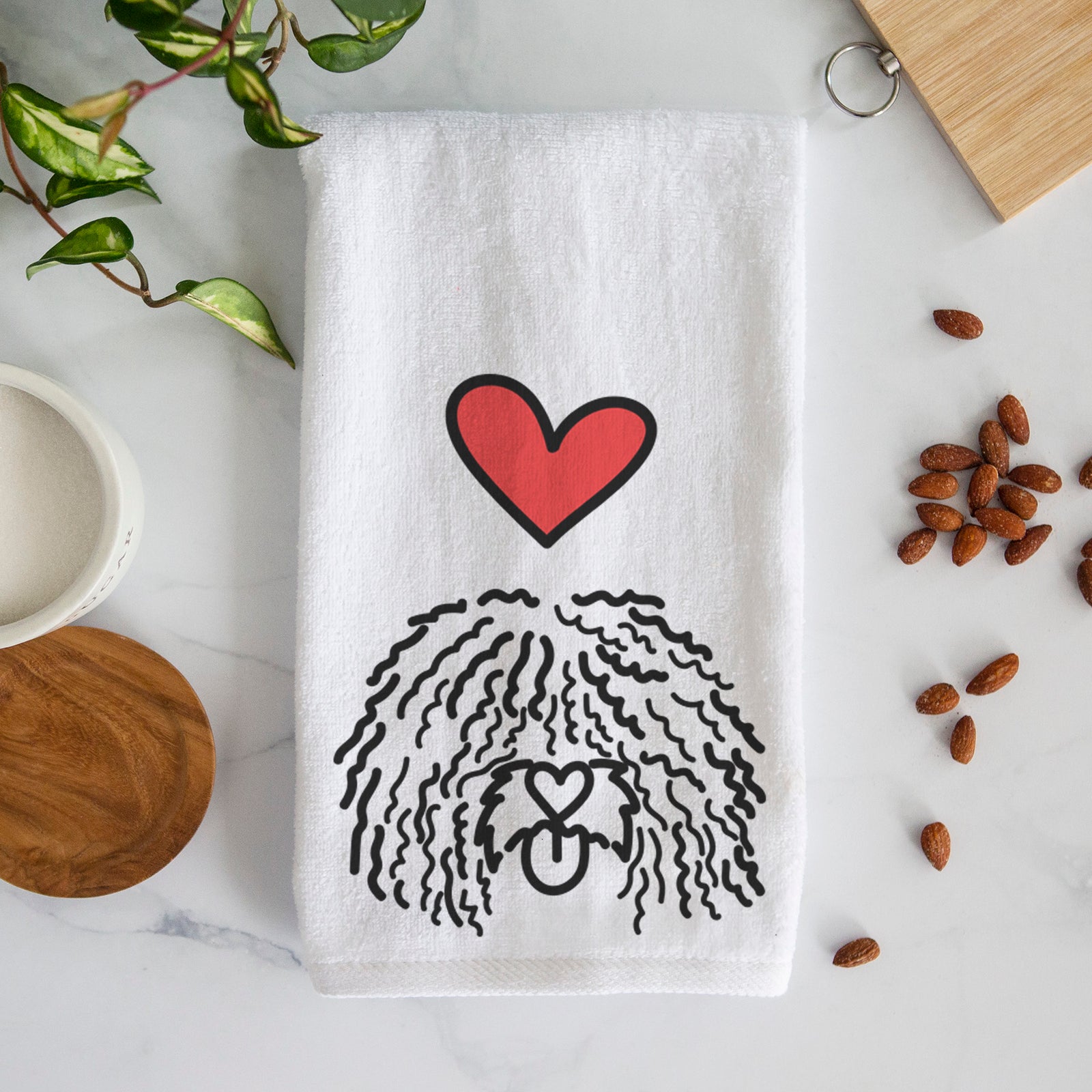 Minimalist line drawing of Alba the Spanish Water Dog with a red heart on a decorative hand towel