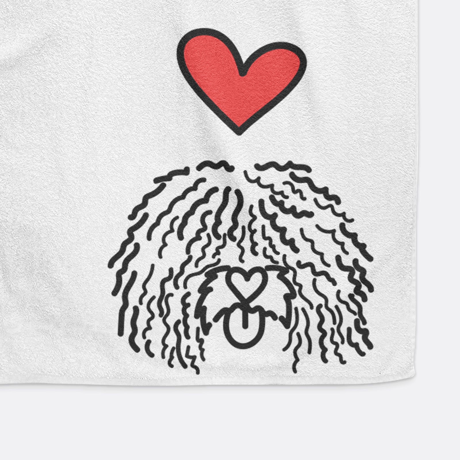 Minimalist line drawing of Alba the Spanish Water Dog with a red heart on a decorative hand towel