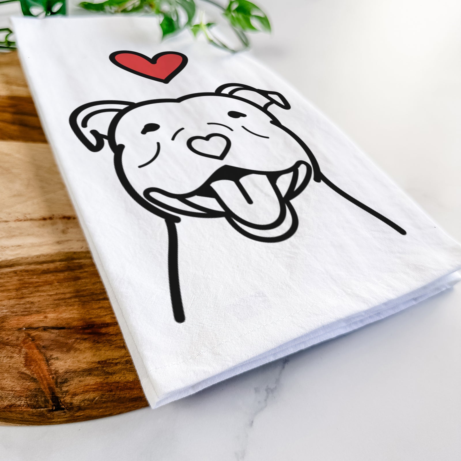 Minimalist line drawing of a Happy American Staffordshire Terrier with a red heart on a tea towel