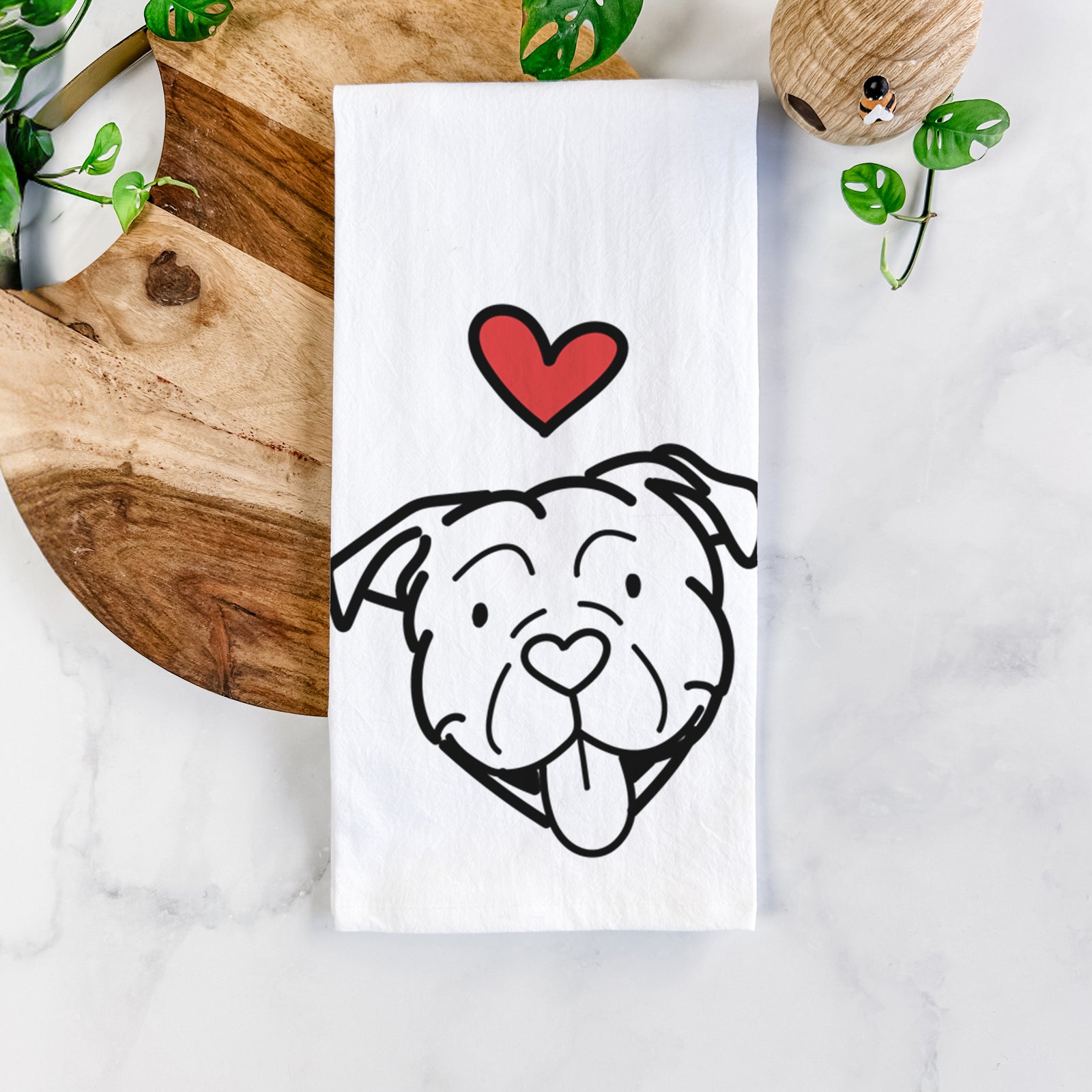 Minimalist line drawing of an American Bulldog with a red heart on a tea towel