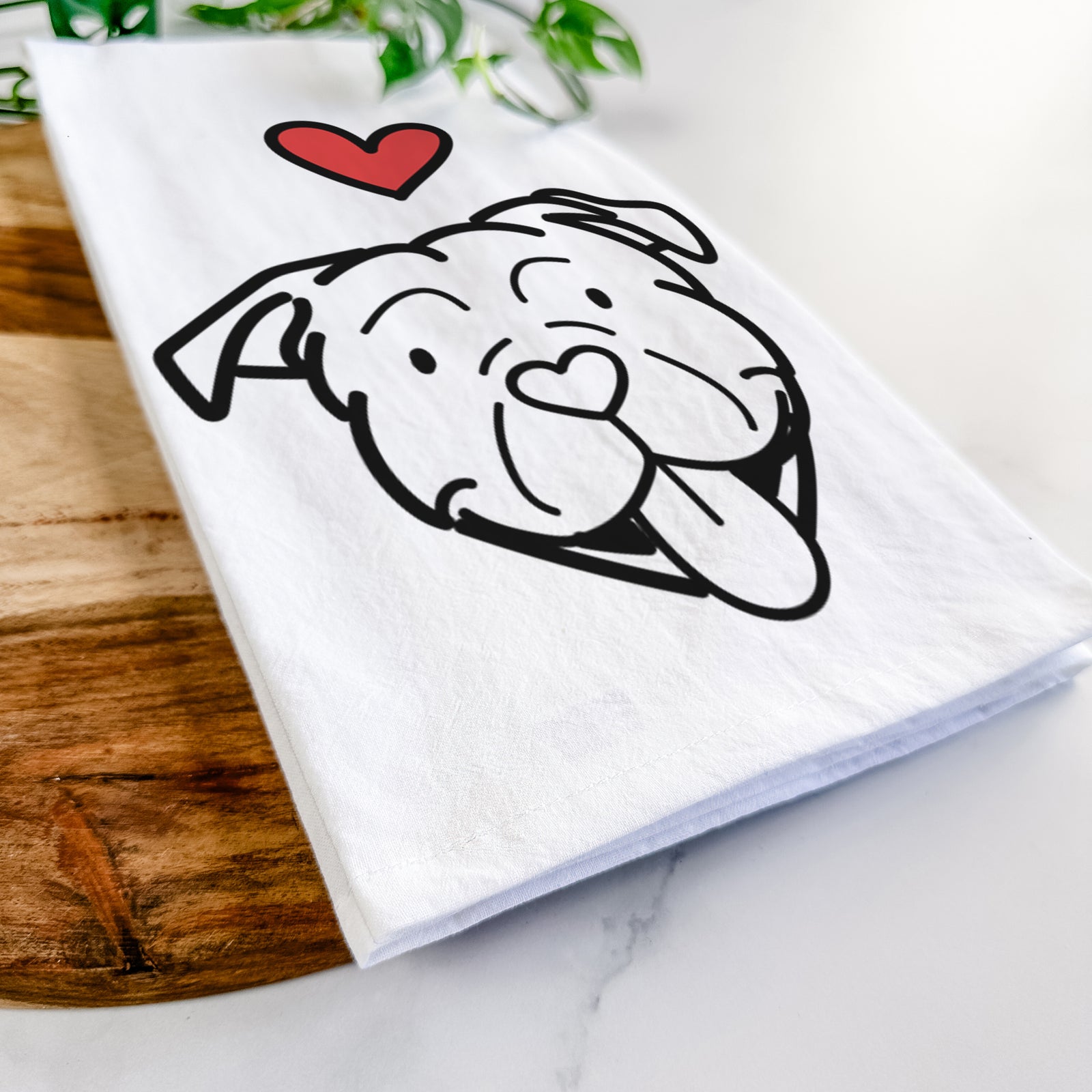 Minimalist line drawing of an American Bulldog with a red heart on a tea towel