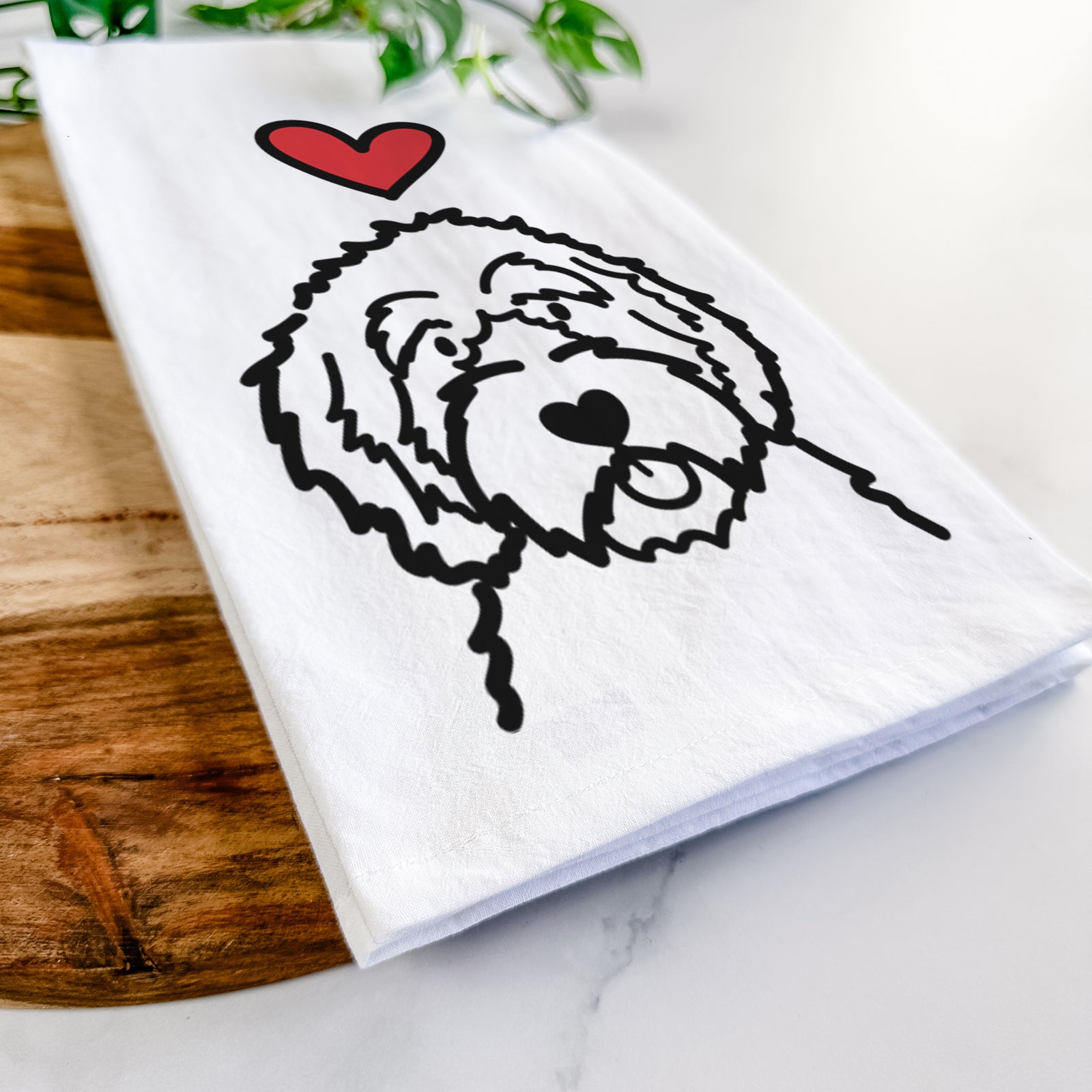 Minimalist line drawing of an Aussiedoodle with a red heart on a tea towel