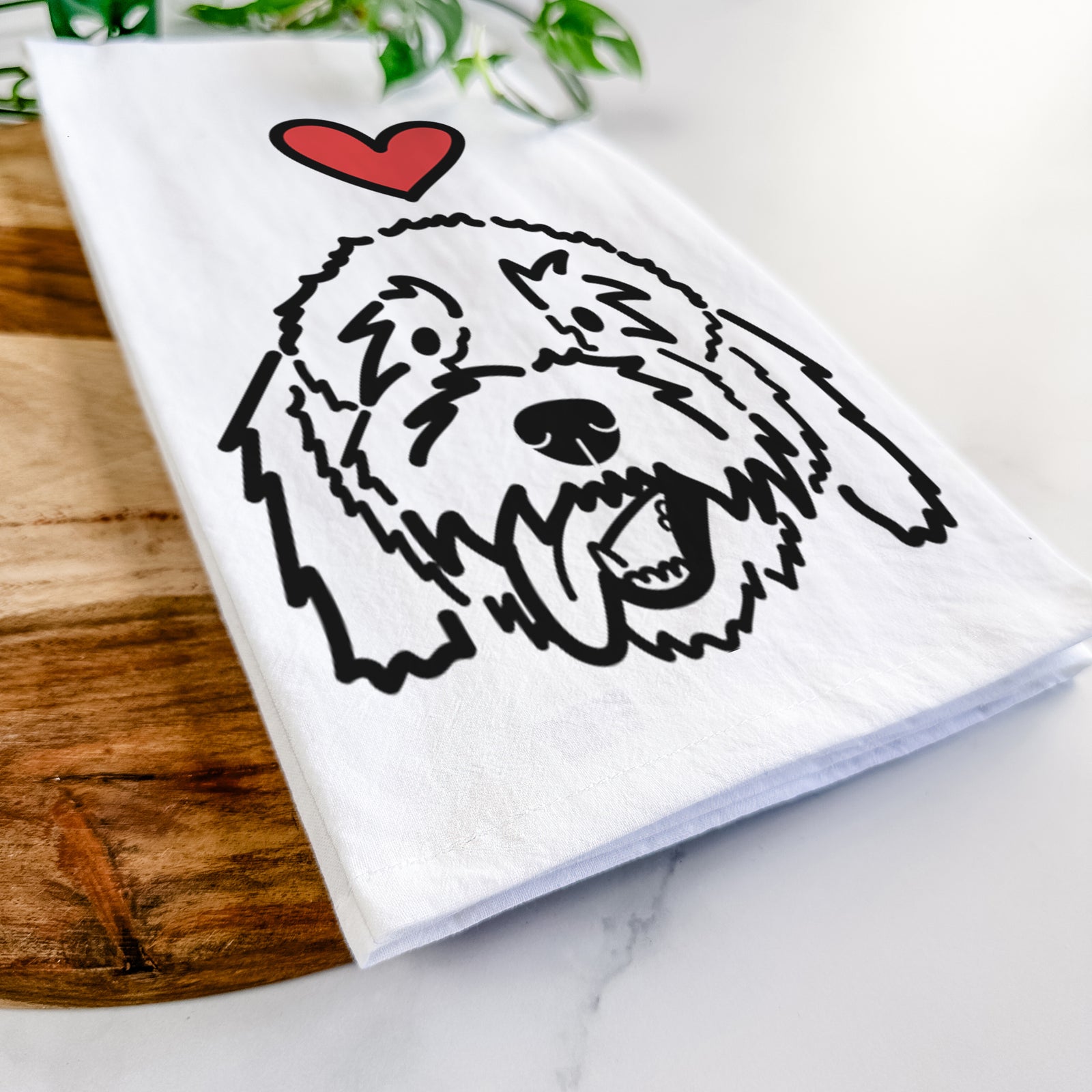 Minimalist line drawing of Barry the Goldendoodle with a red heart on a tea towel